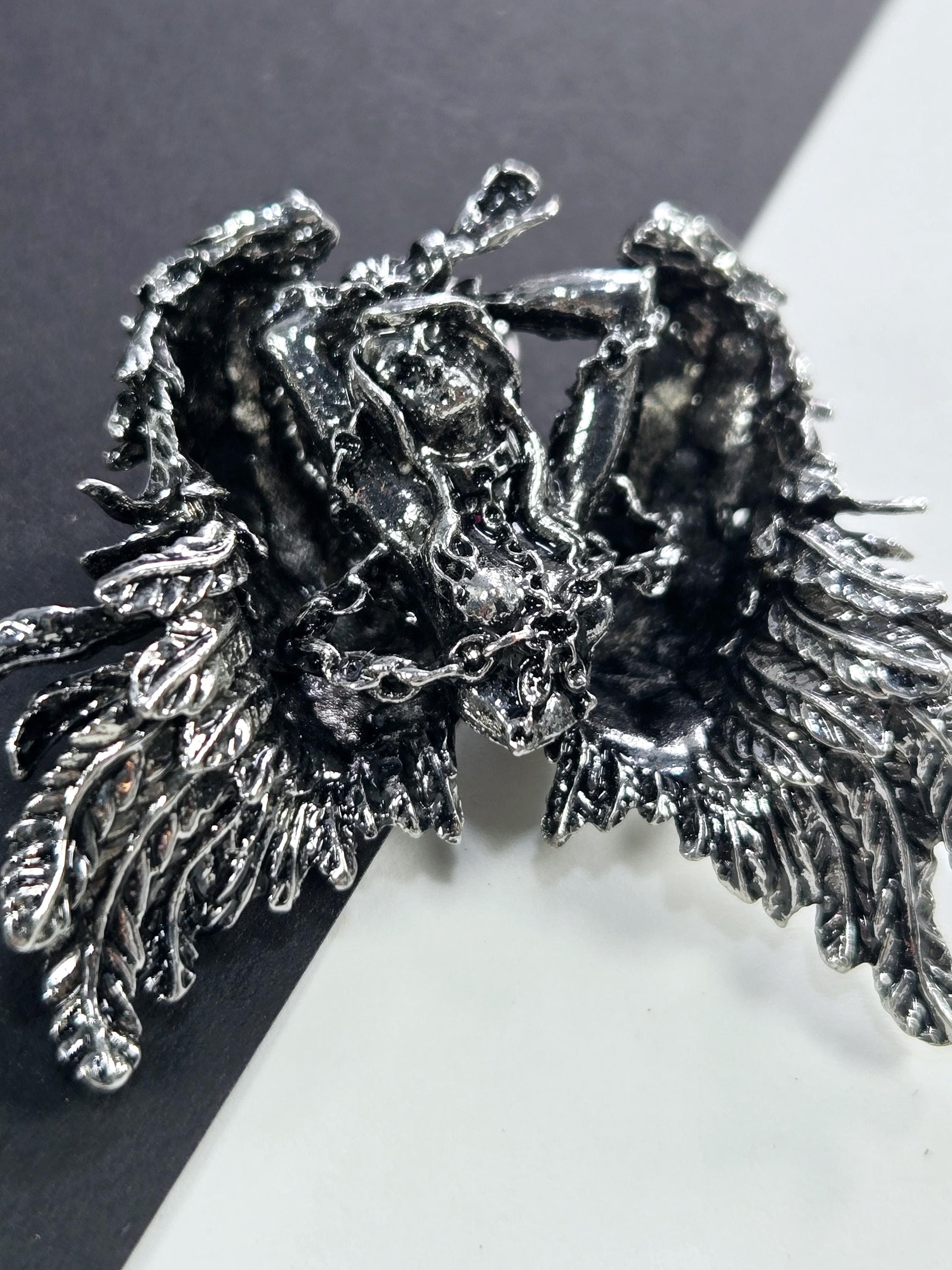 a close-up view of a detailed, intricate metal sculpture with a textured, organic appearance.