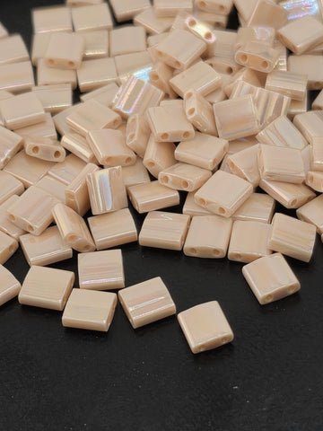 a pile of small, square-shaped objects with a black background.