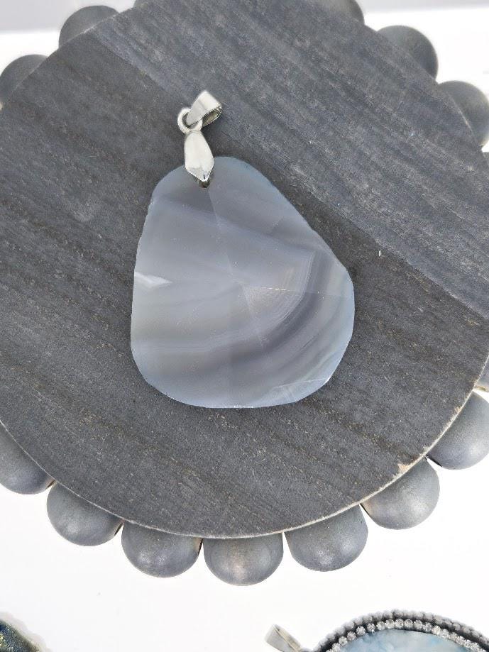 a large, irregularly shaped stone with a unique, striped pattern.