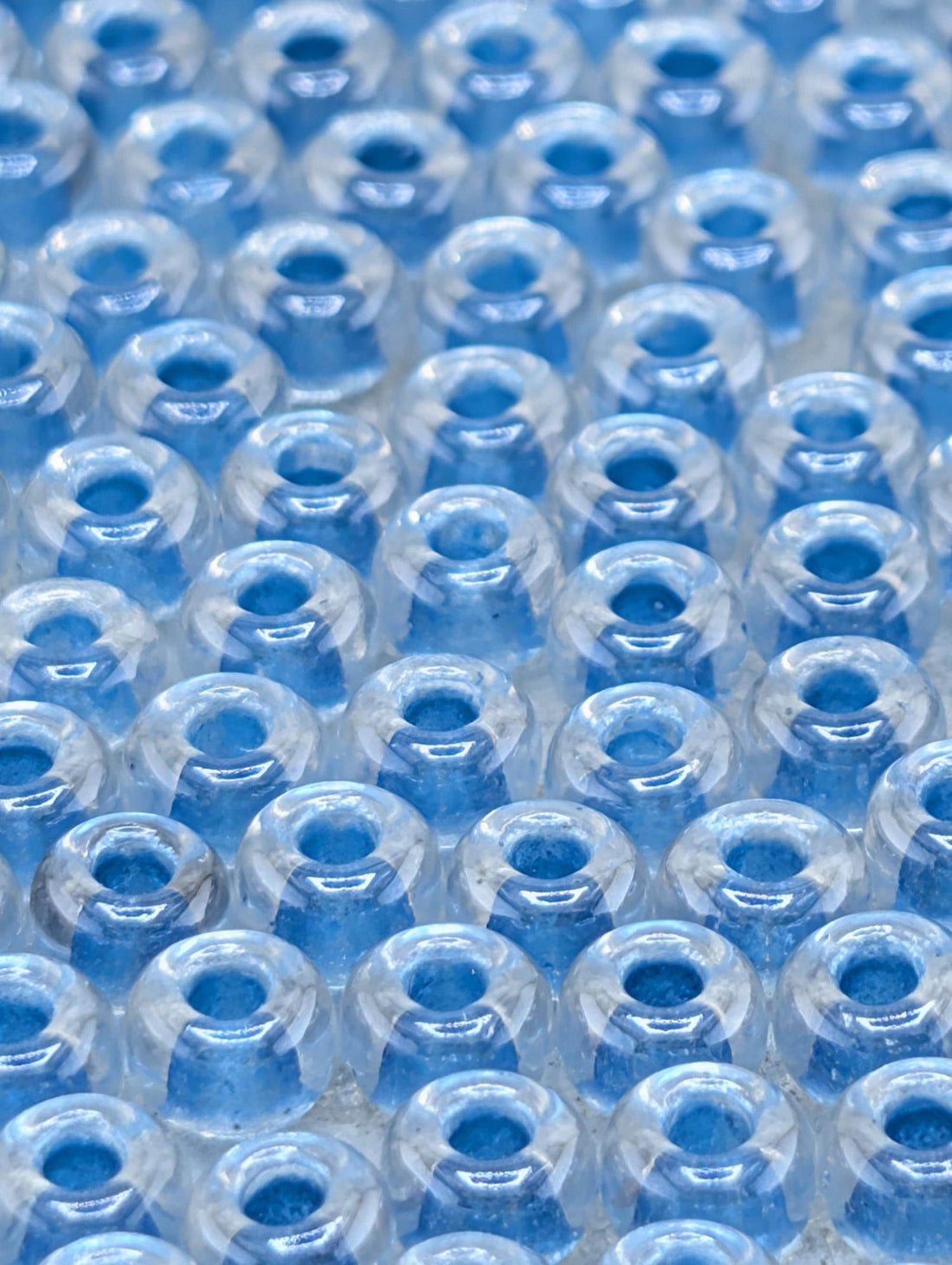 6-1529:Crystal/Med Blue ICL*-Miyuki Rocaille 6/0 (20g pkg ~240 pcs)