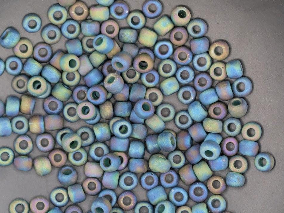 Matsuno Seed Beads Size 6: Transparent Frosted Rainbow Peacock, 15g Pack