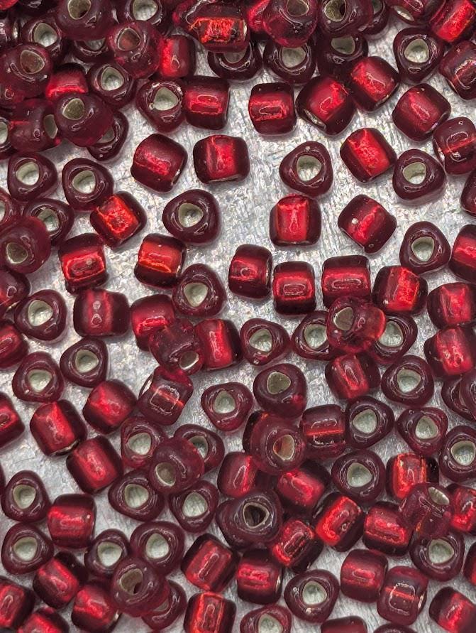 Dark Red Translucent Silver Lined Miyuki Triangle Size 8/0 (15g Pkg)