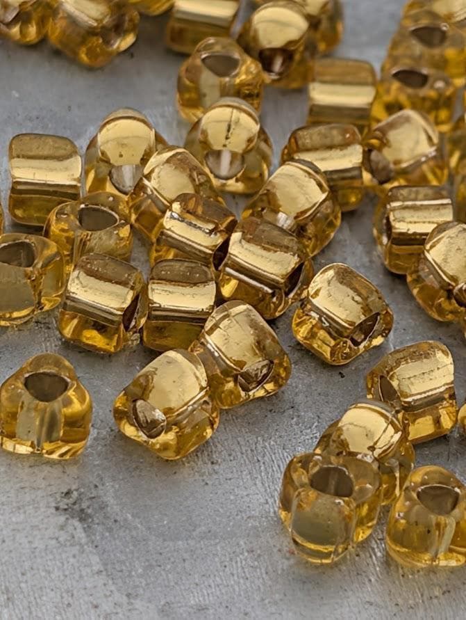 Gold Translucent Silver Lined Miyuki Triangle Size 5/0 (15g Pkg)