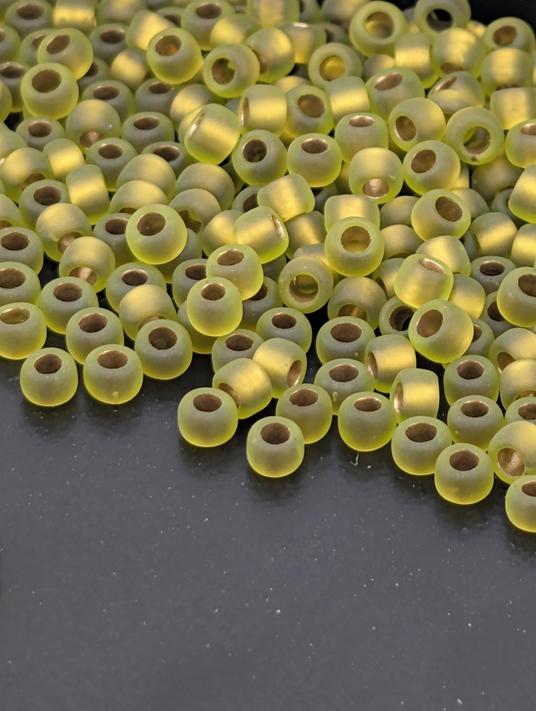 Gold-Lined Rainbow Frosted Peridot Size 8/0 Toho Round 2.5" tube