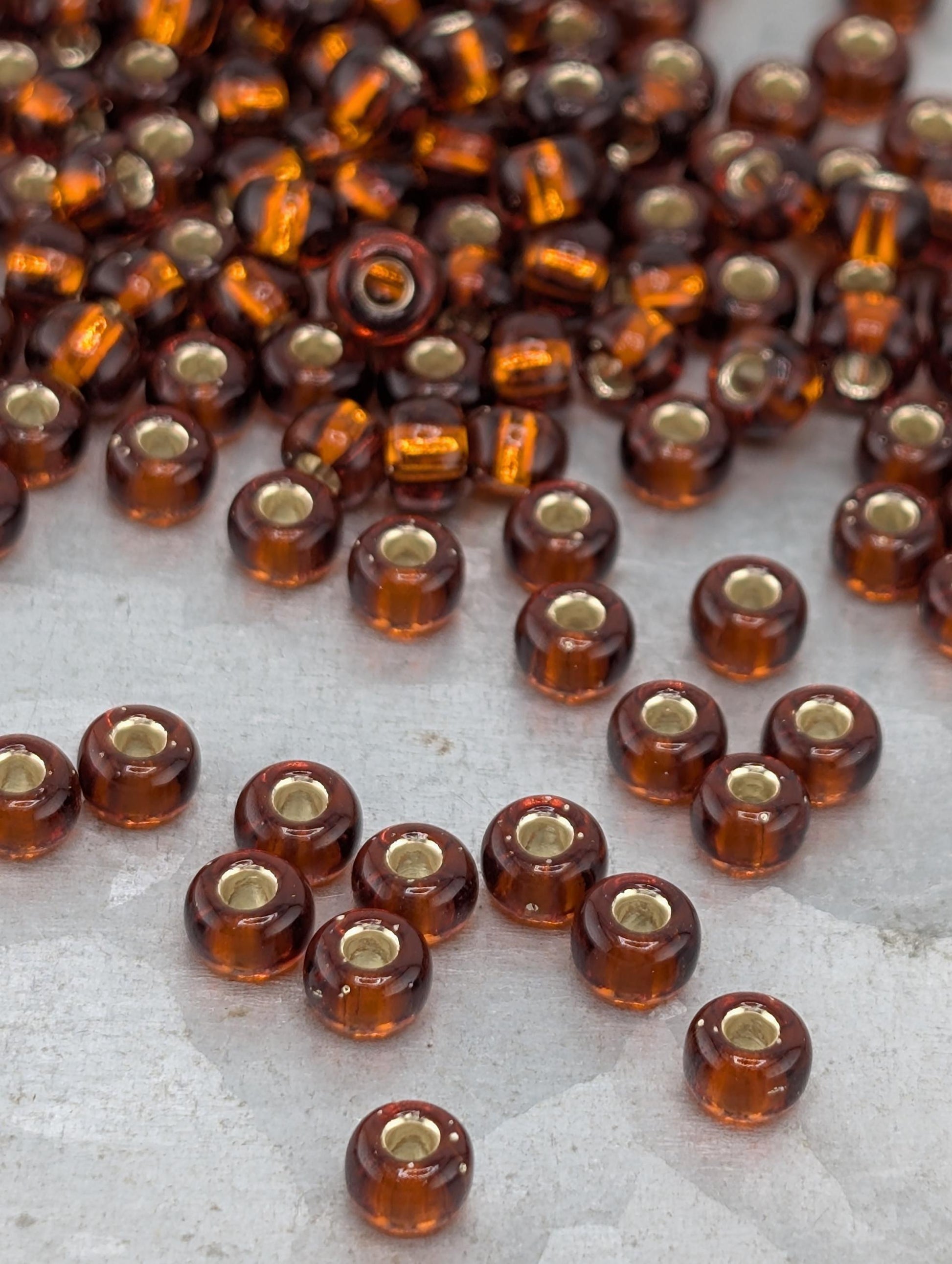 6-0005:Dark Topaz T/Sl-Miyuki Rocaille 6/0