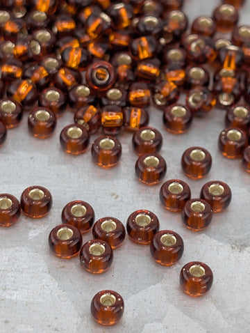 6-0005:Dark Topaz T/Sl-Miyuki Rocaille 6/0