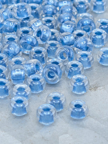 6-1529:Crystal/Med Blue ICL*-Miyuki Rocaille 6/0 (20g pkg ~240 pcs)