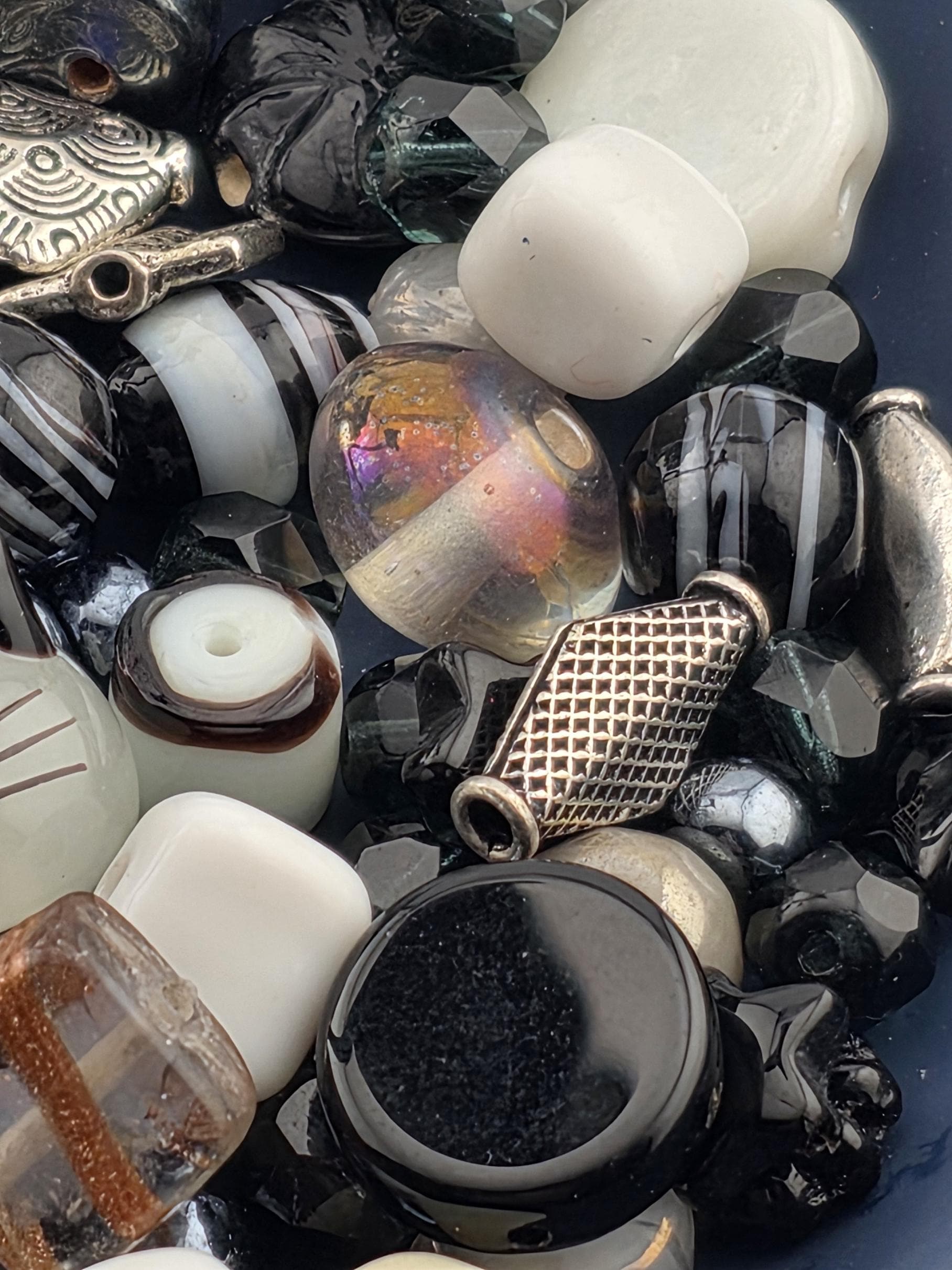 a variety of colorful glass beads and beads in different shapes and sizes, arranged in a visually appealing manner.