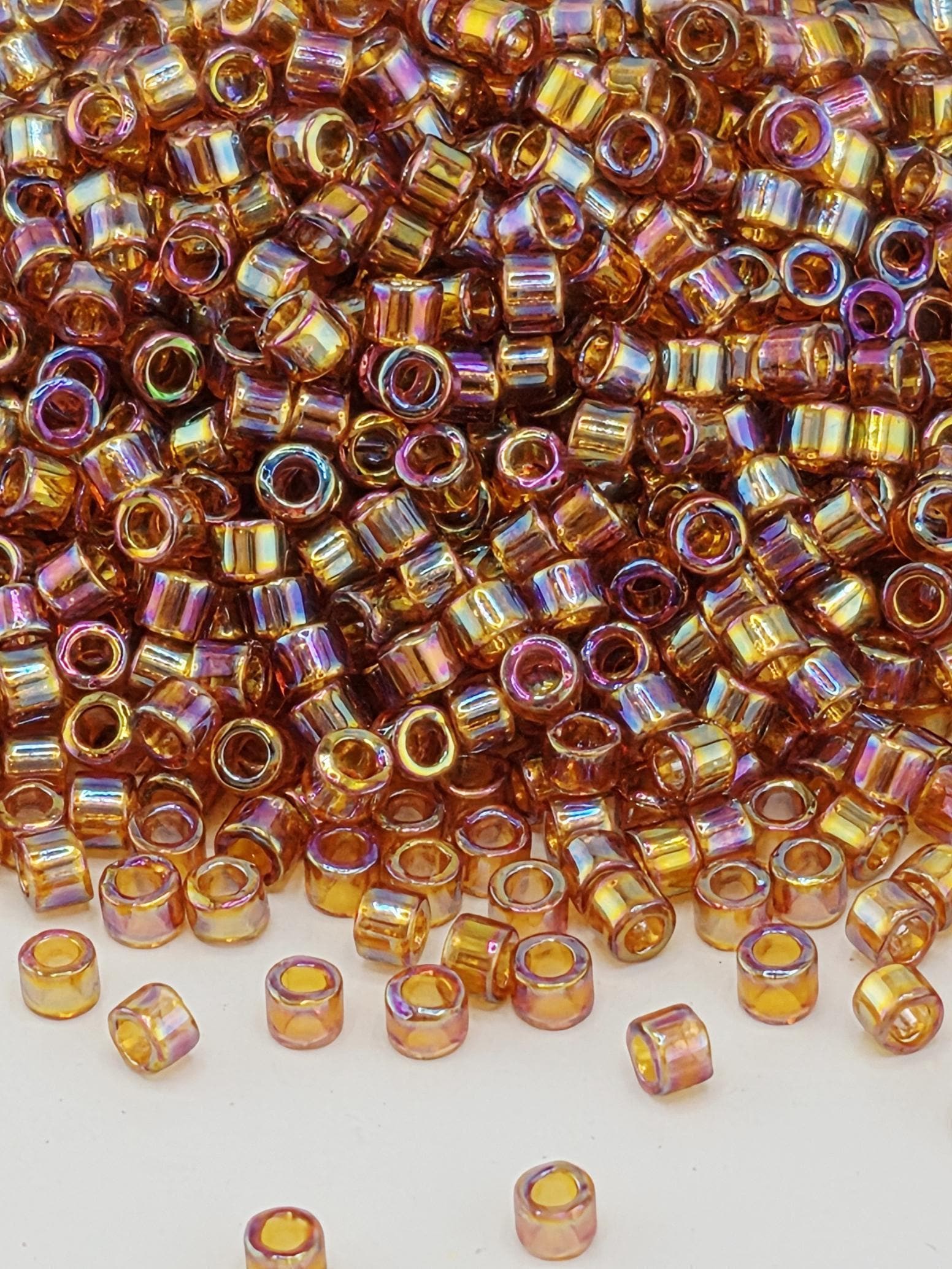 DB0170:Amber Translucent Rainbow Miyuki Delica (Size 11, 7 grams, ~1400 beads)