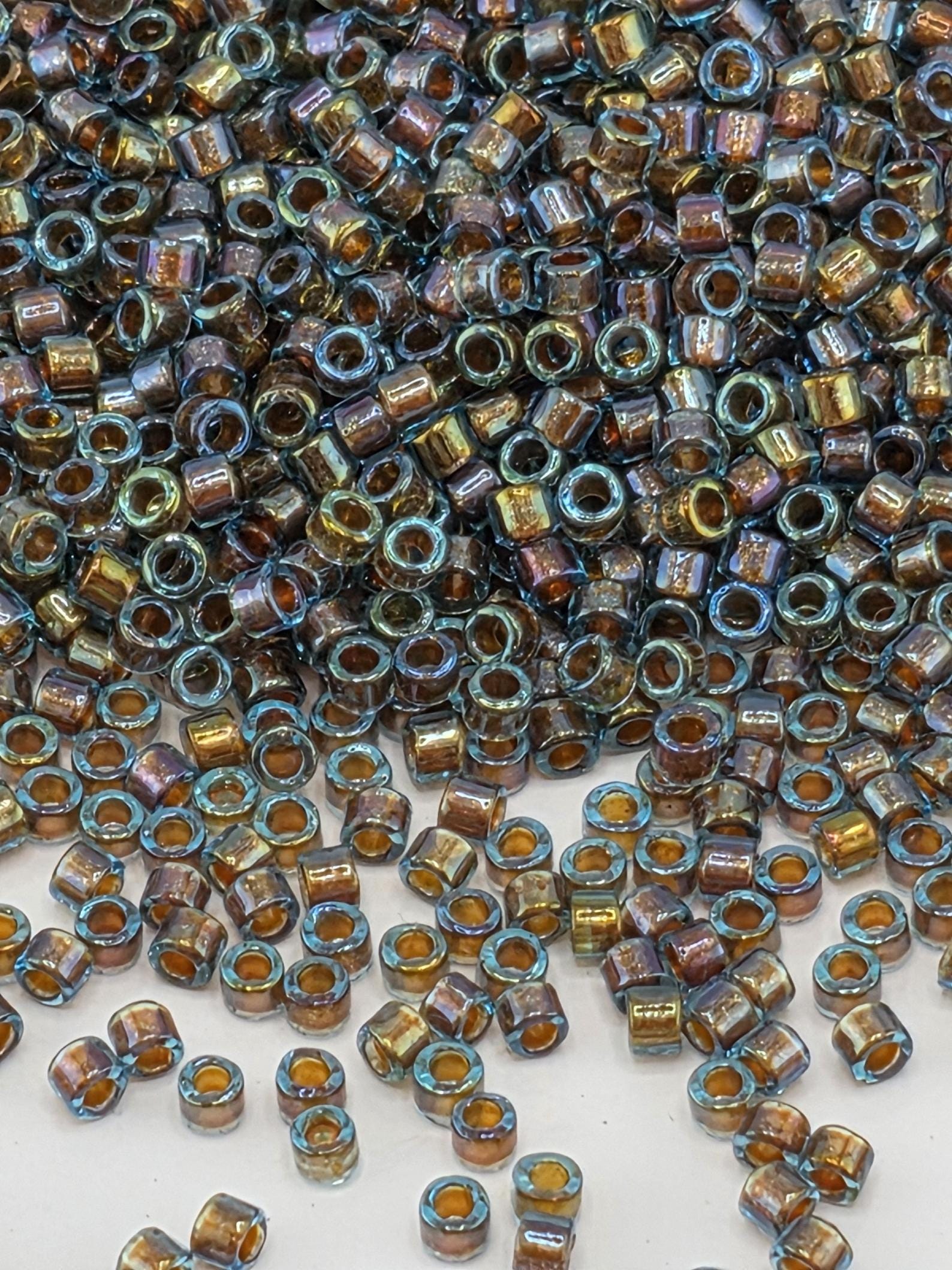 DB1775:Blue/Gold Inside Color Lined Sparkle Rainbow Miyuki Delica (Size 11, 7 grams, ~1400 beads)