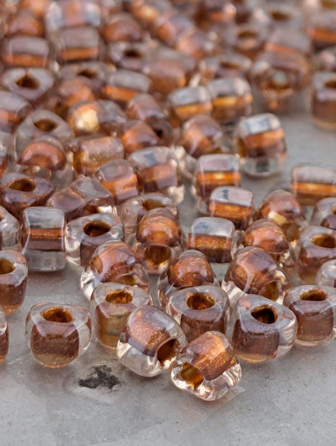 Crystal/Burnt Orange Inside Color Lined Sparkle Miyuki Triangle Size 5/0 (15g Pkg)