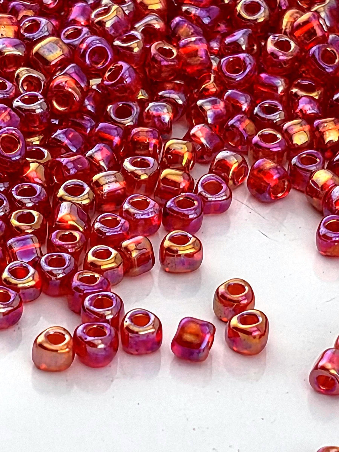 Berry Red Translucent Rainbow Miyuki Triangle Size 10/0 (15g Pkg)