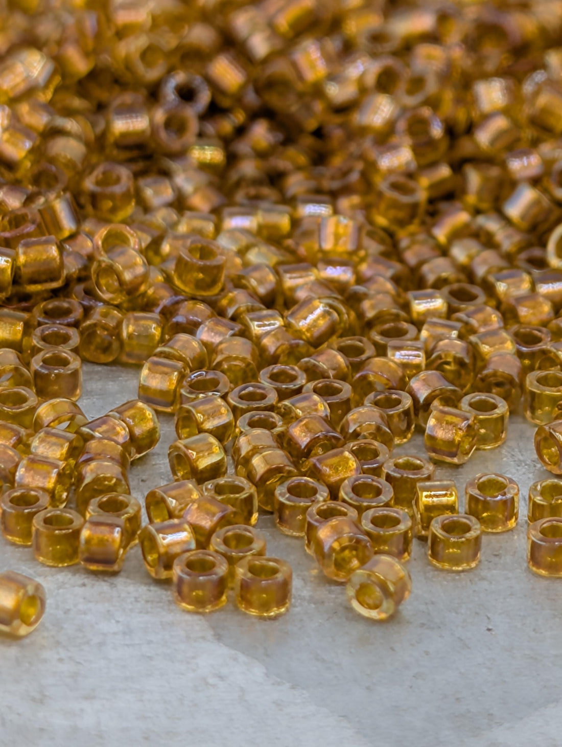 DB0065:Amber/Topaz Inside Color Lined Rainbow Miyuki Delica (Size 11, 7 grams, ~1400 beads)