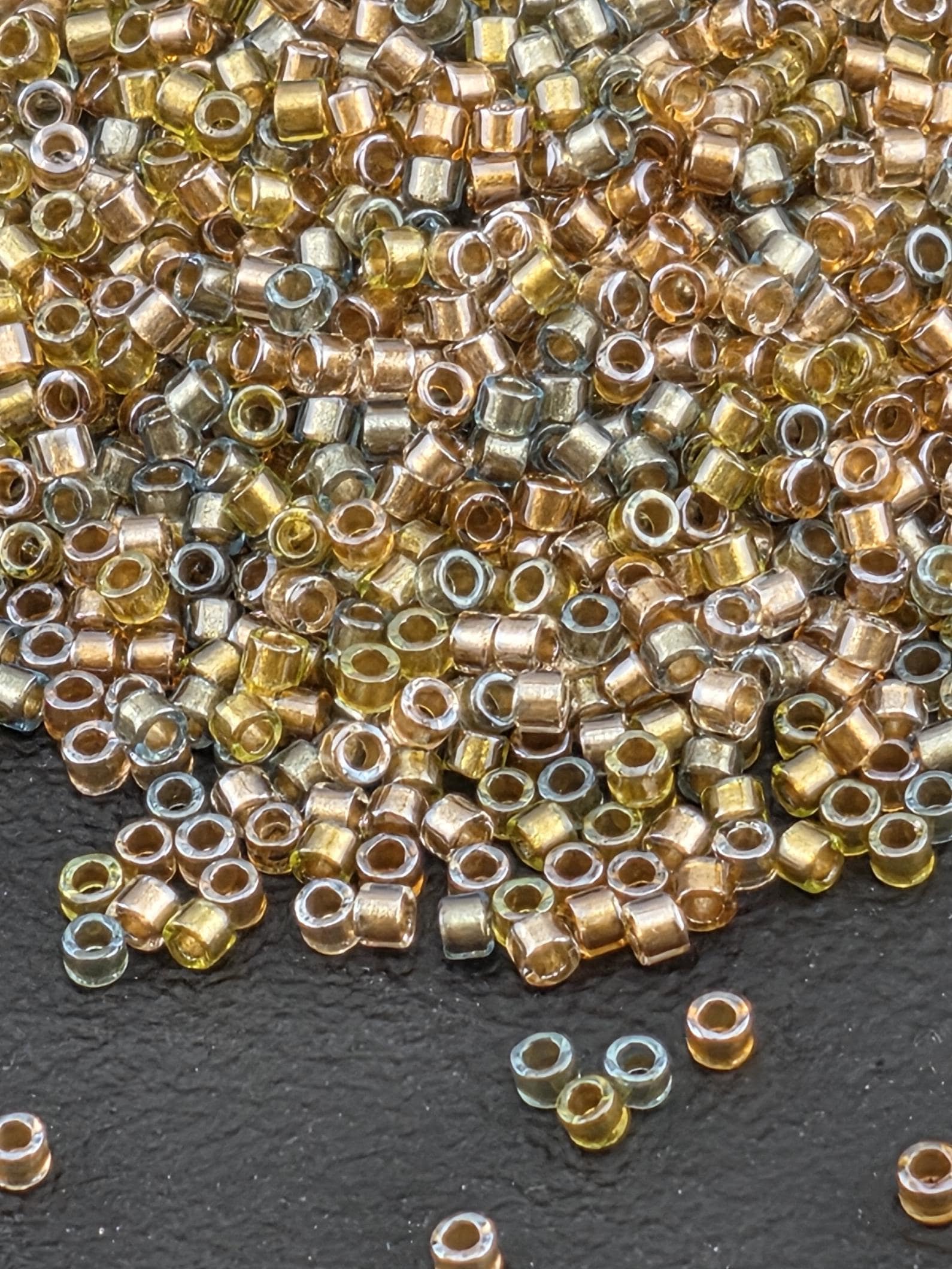 DB0981:Taupe/Amber Mix Inside Color Lined Sparkle Duracoat Miyuki Delica (Size 11, 7 grams, ~1400 beads)