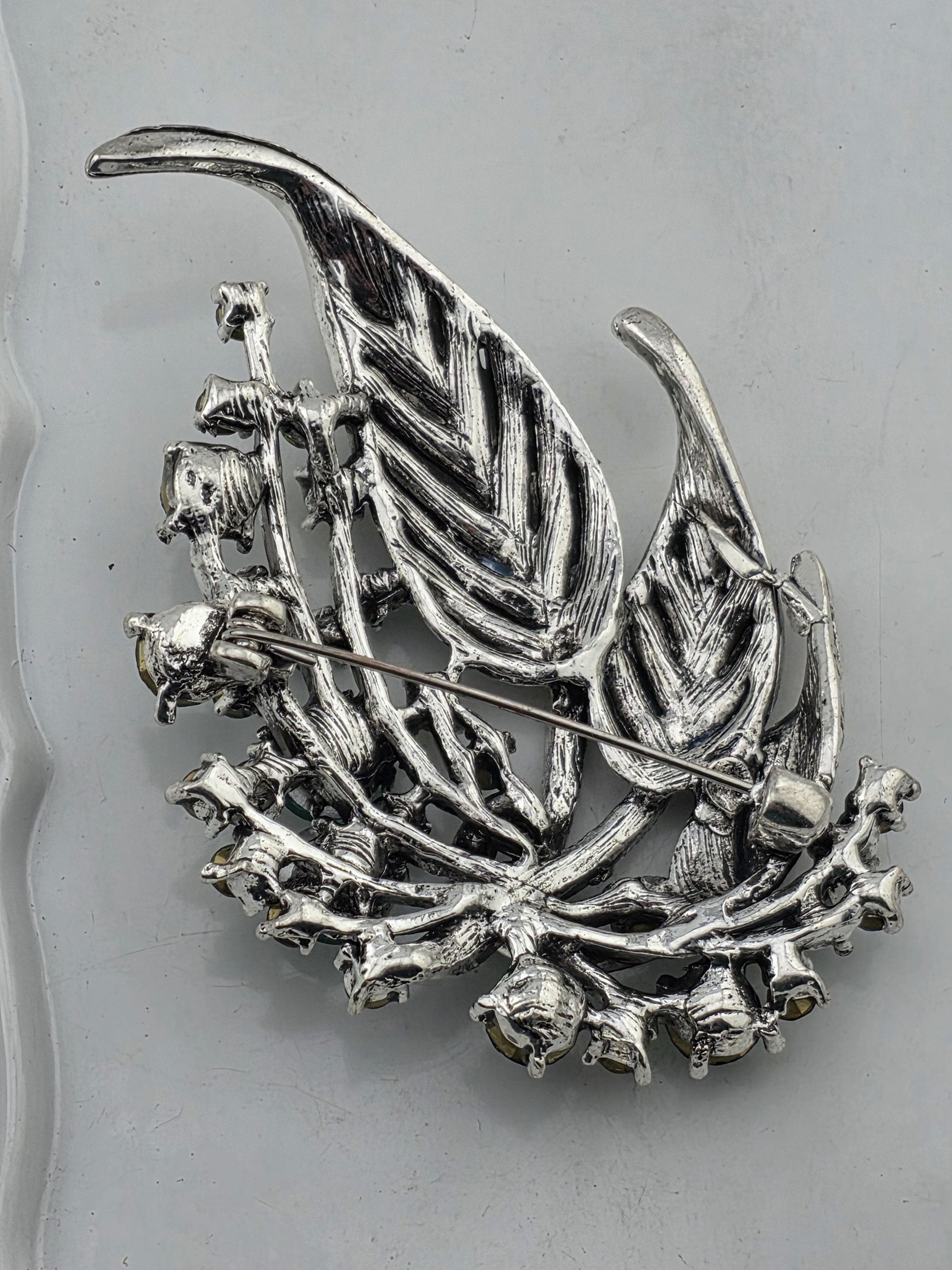 Silver Plated Feather Brooch: Blue Topaz and Emerald Rhinestone Pin