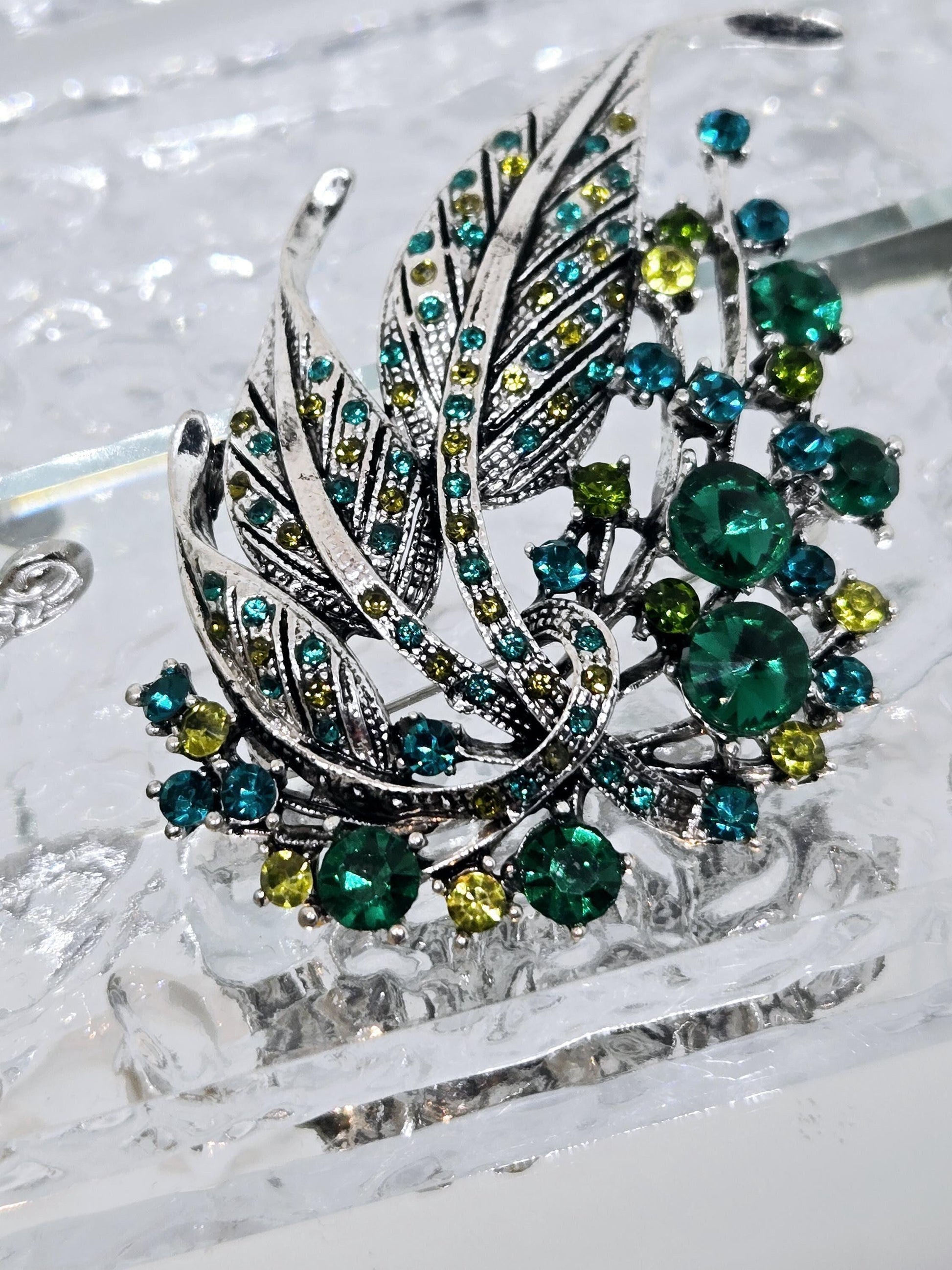 Silver Plated Feather Brooch: Blue Topaz and Emerald Rhinestone Pin