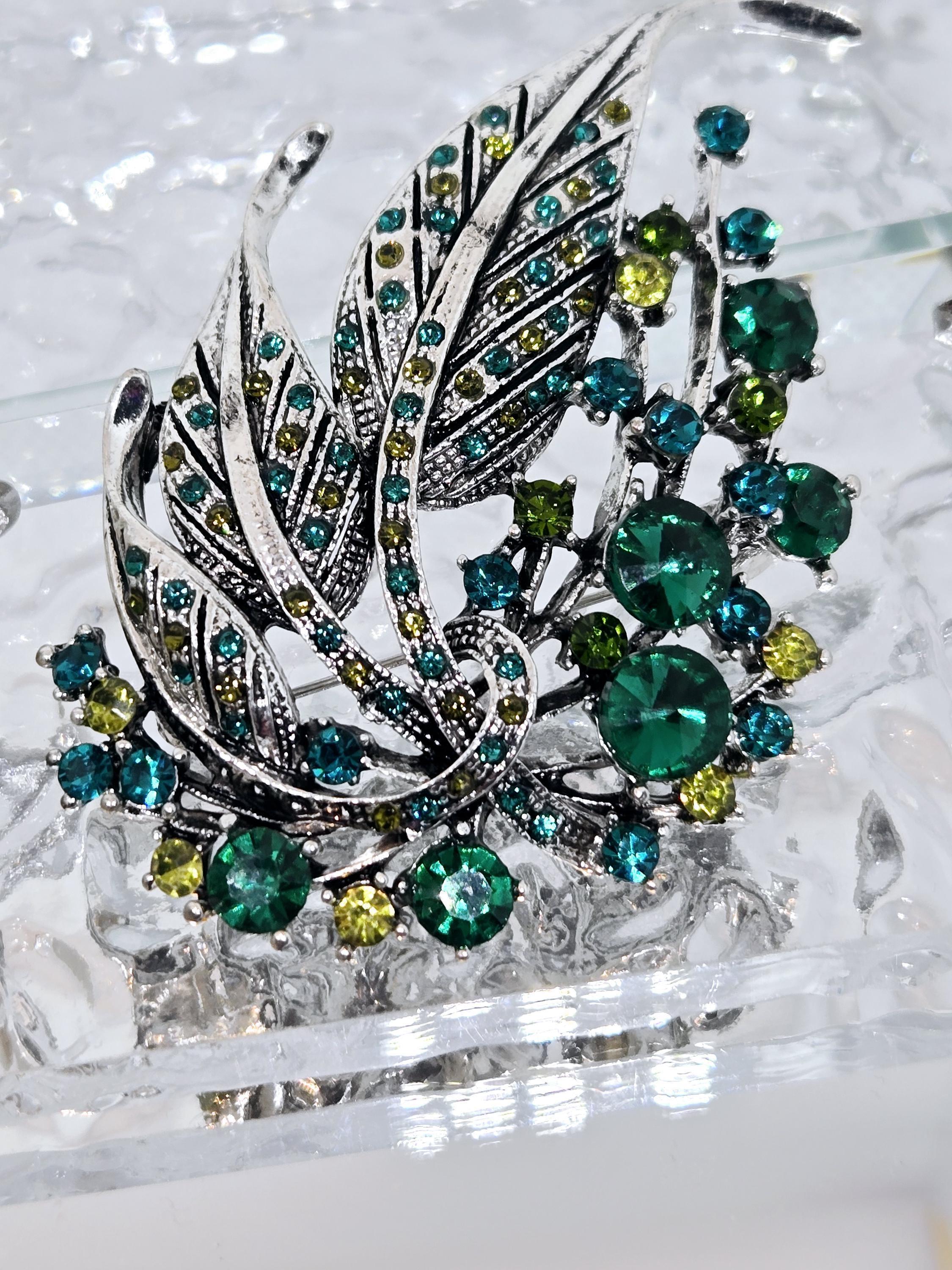 Silver Plated Feather Brooch: Blue Topaz and Emerald Rhinestone Pin