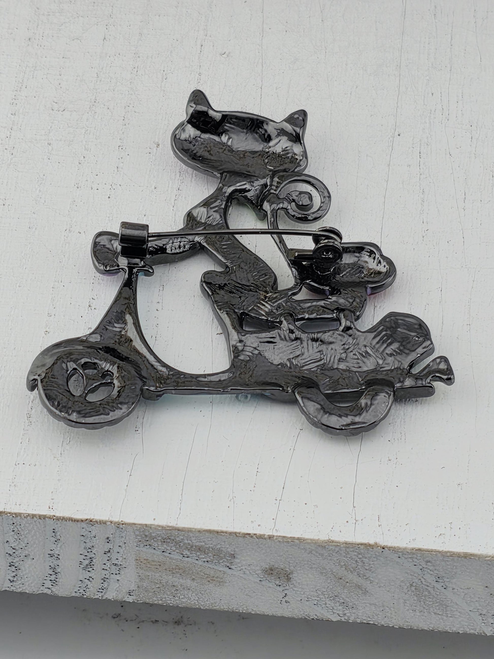 a black metal sculpture with a unique, abstract design.