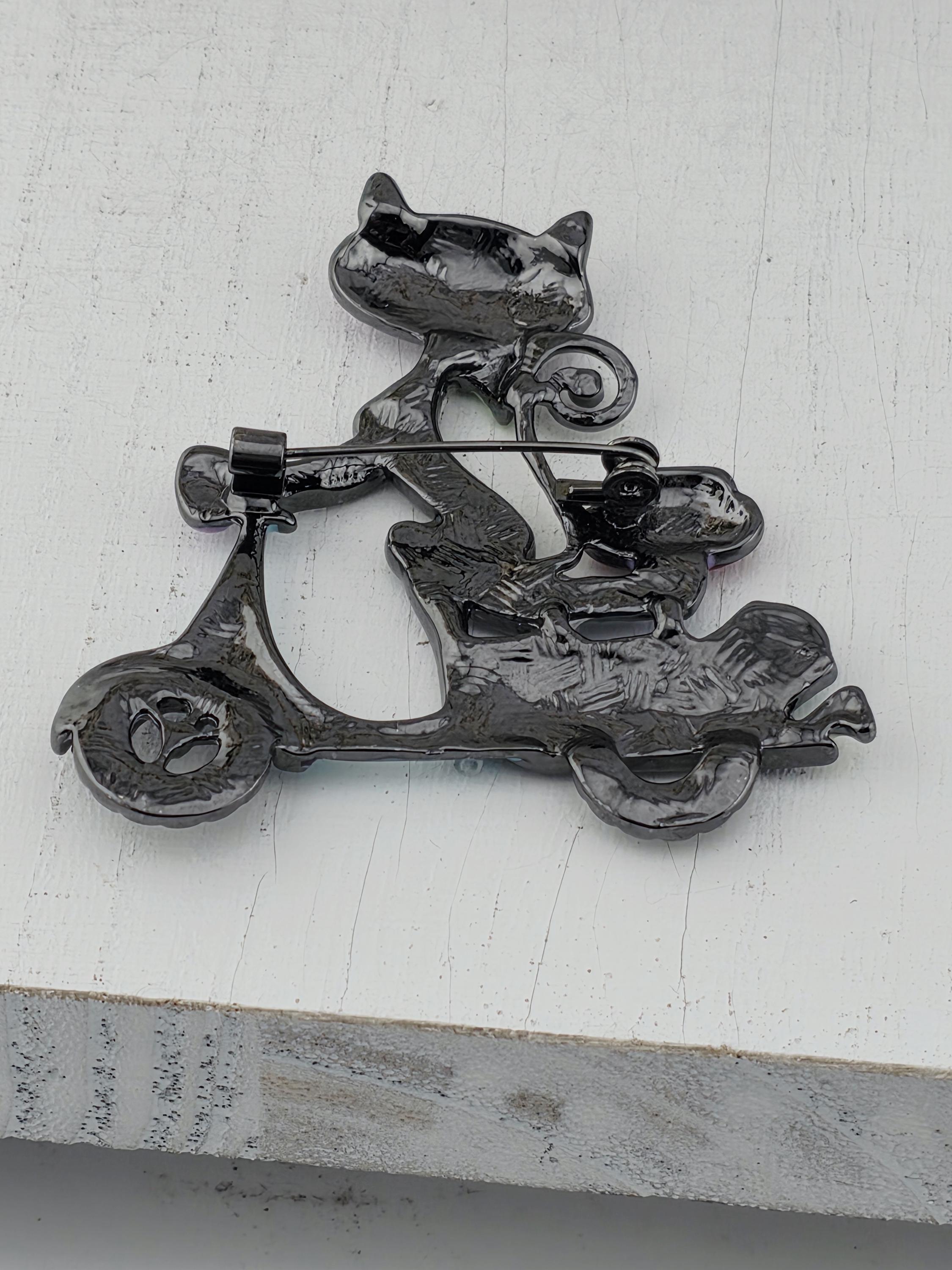 a black metal sculpture with a unique, abstract design.