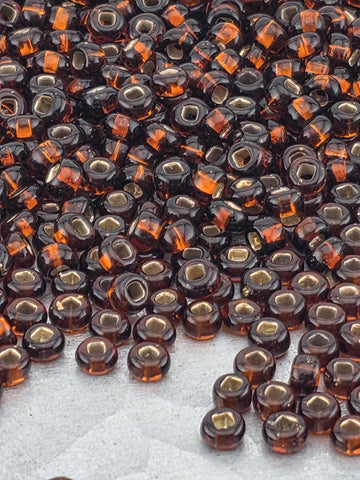 Transparent Silver Lined Dark Topaz | Size 8 | 15g | Preciosa-Ornela Glass Seed Beads
