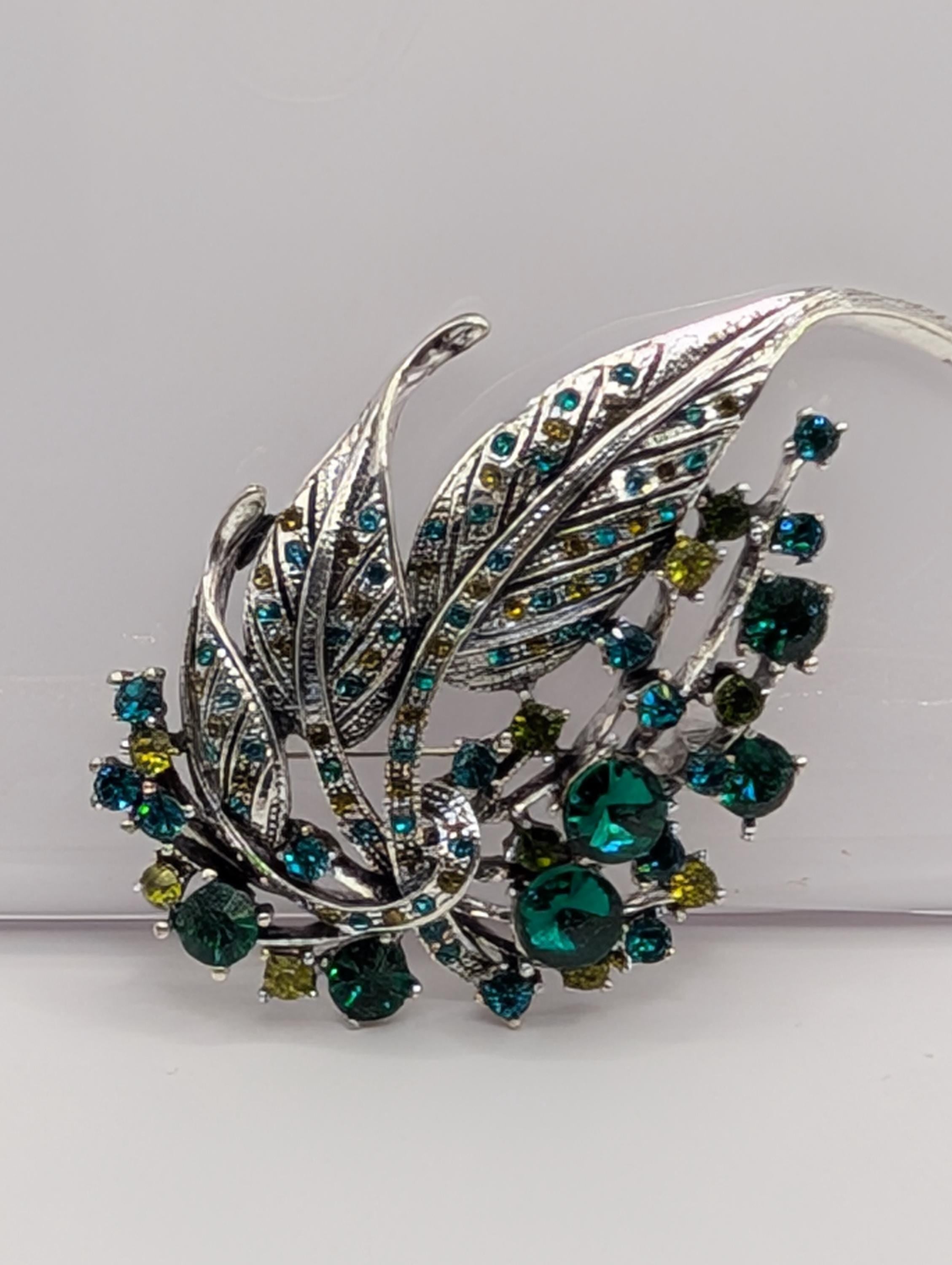 Silver Plated Feather Brooch: Blue Topaz and Emerald Rhinestone Pin