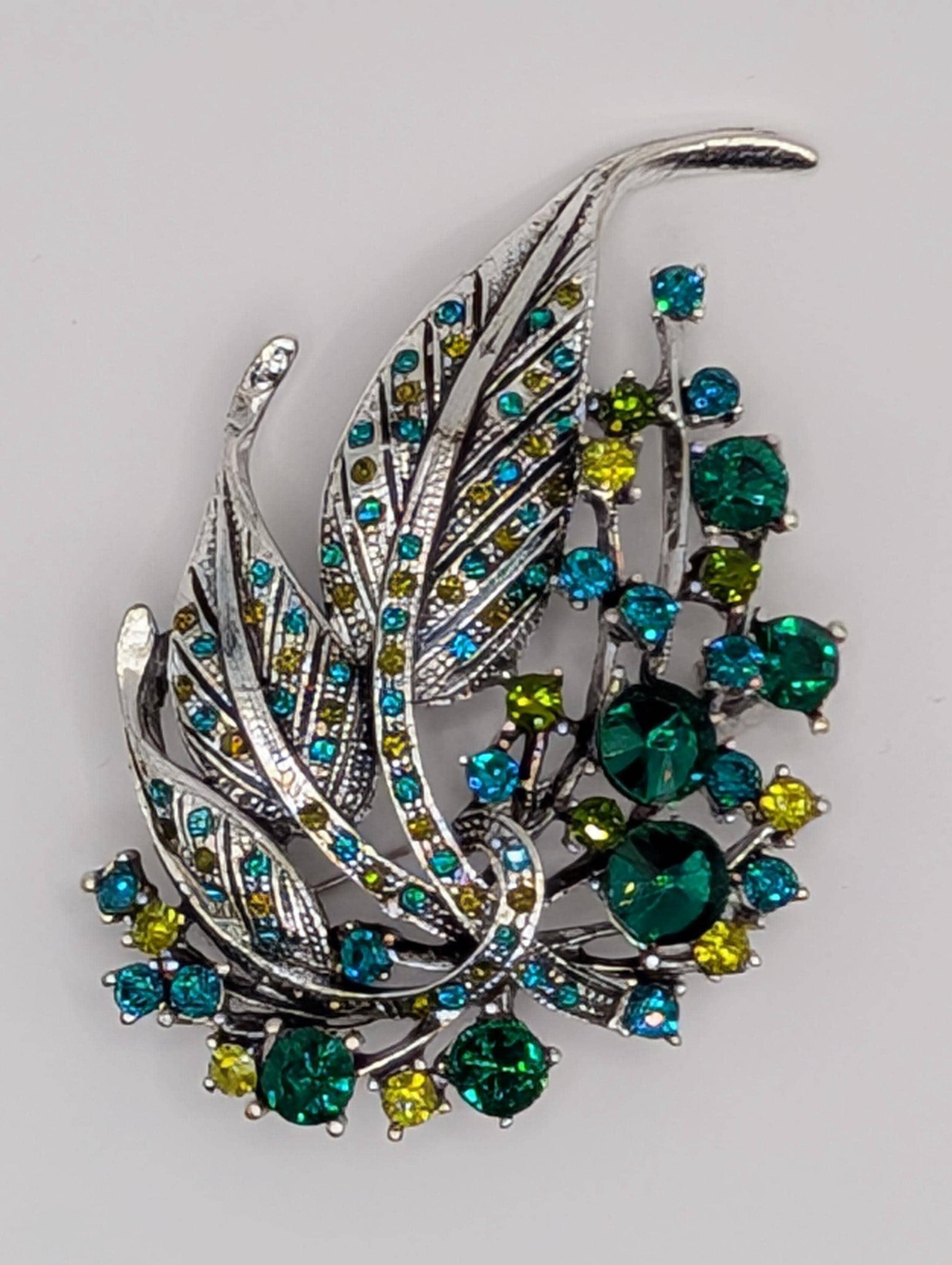 Silver Plated Feather Brooch: Blue Topaz and Emerald Rhinestone Pin