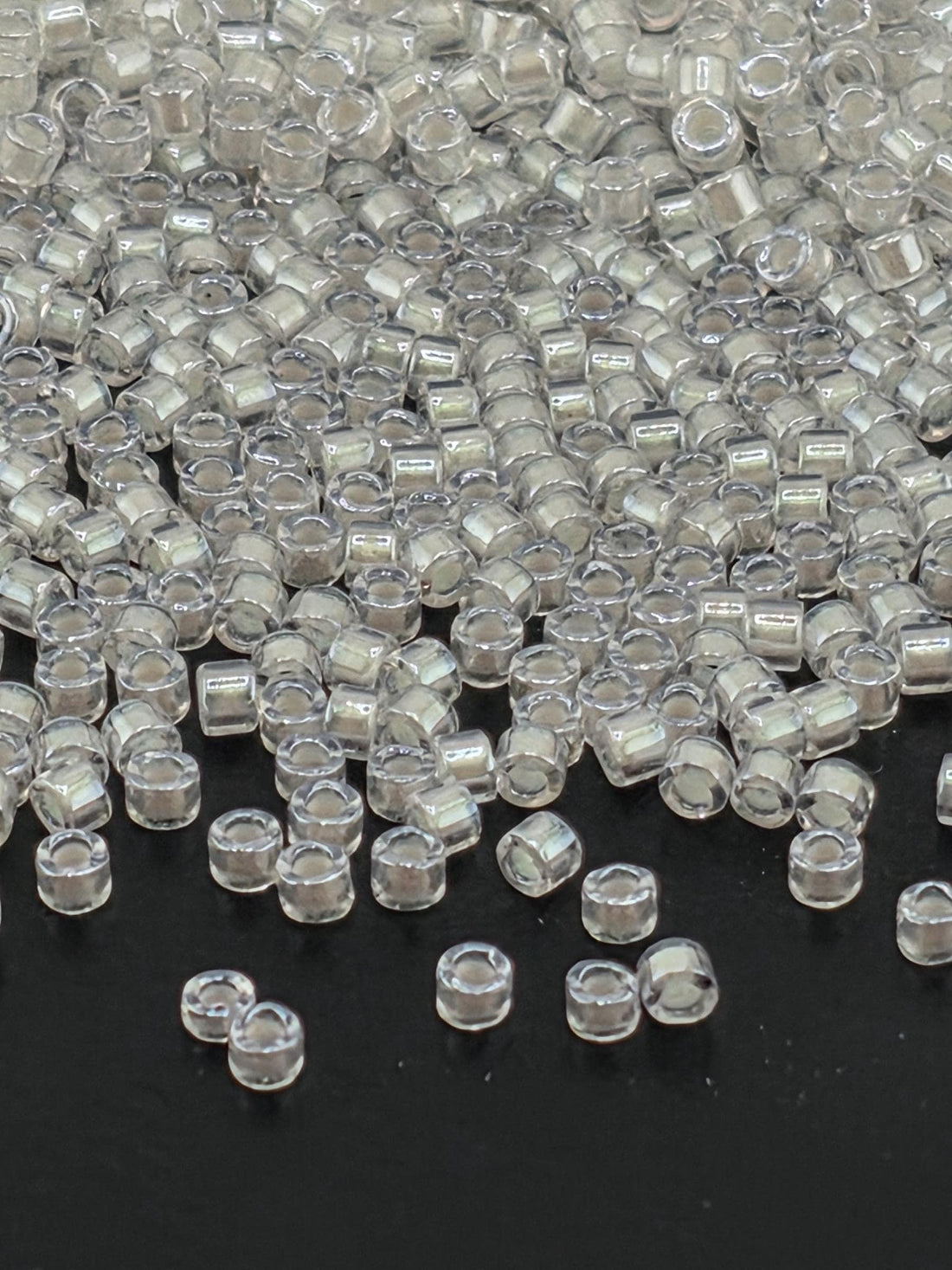 DB1701:Crystal/Candle Lit Translucent Inside Color Lined Pearl | Size 11/0 | 7g