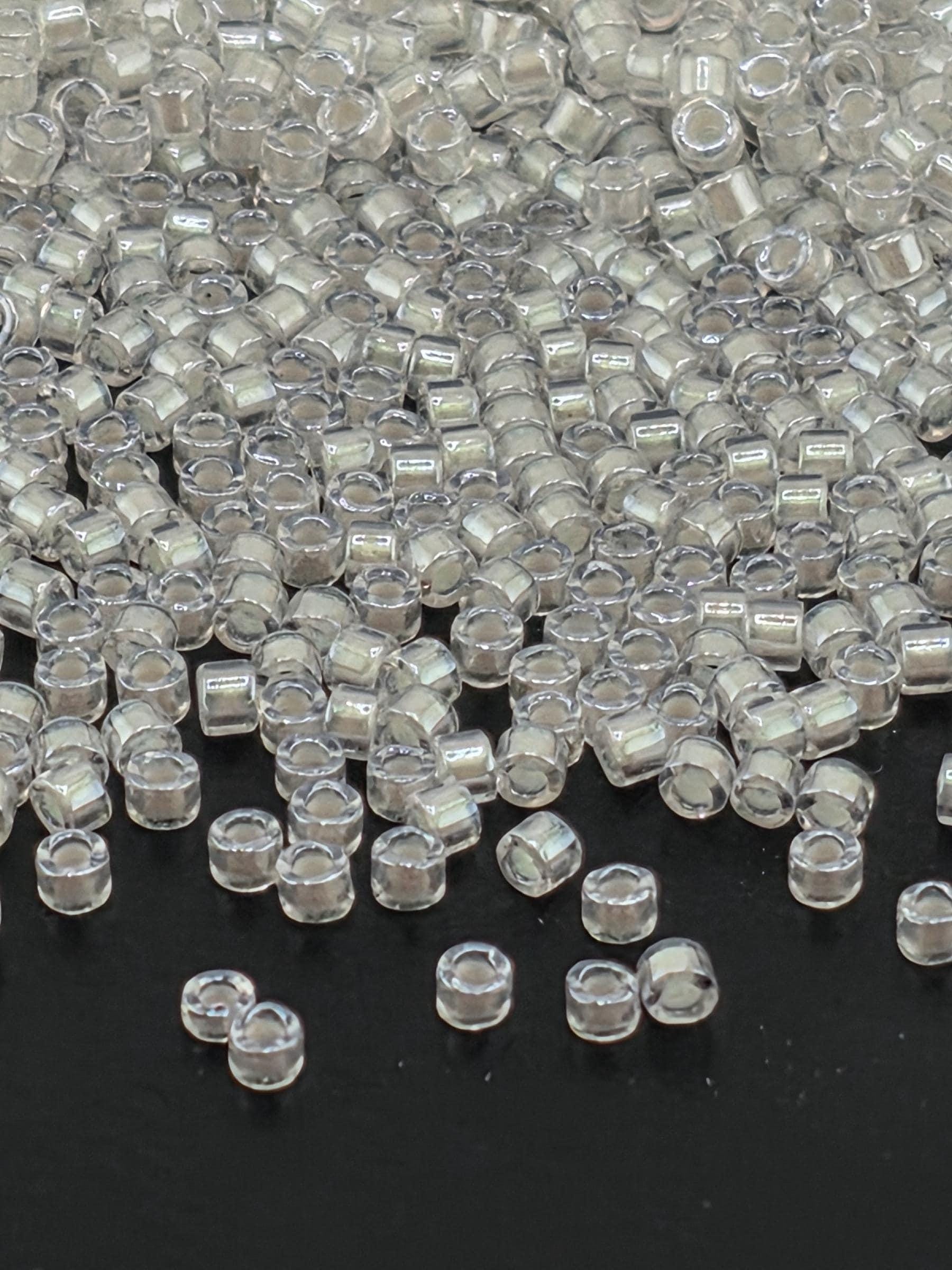 DB1701:Crystal/Candle Lit Translucent Inside Color Lined Pearl | Size 11/0 | 7g