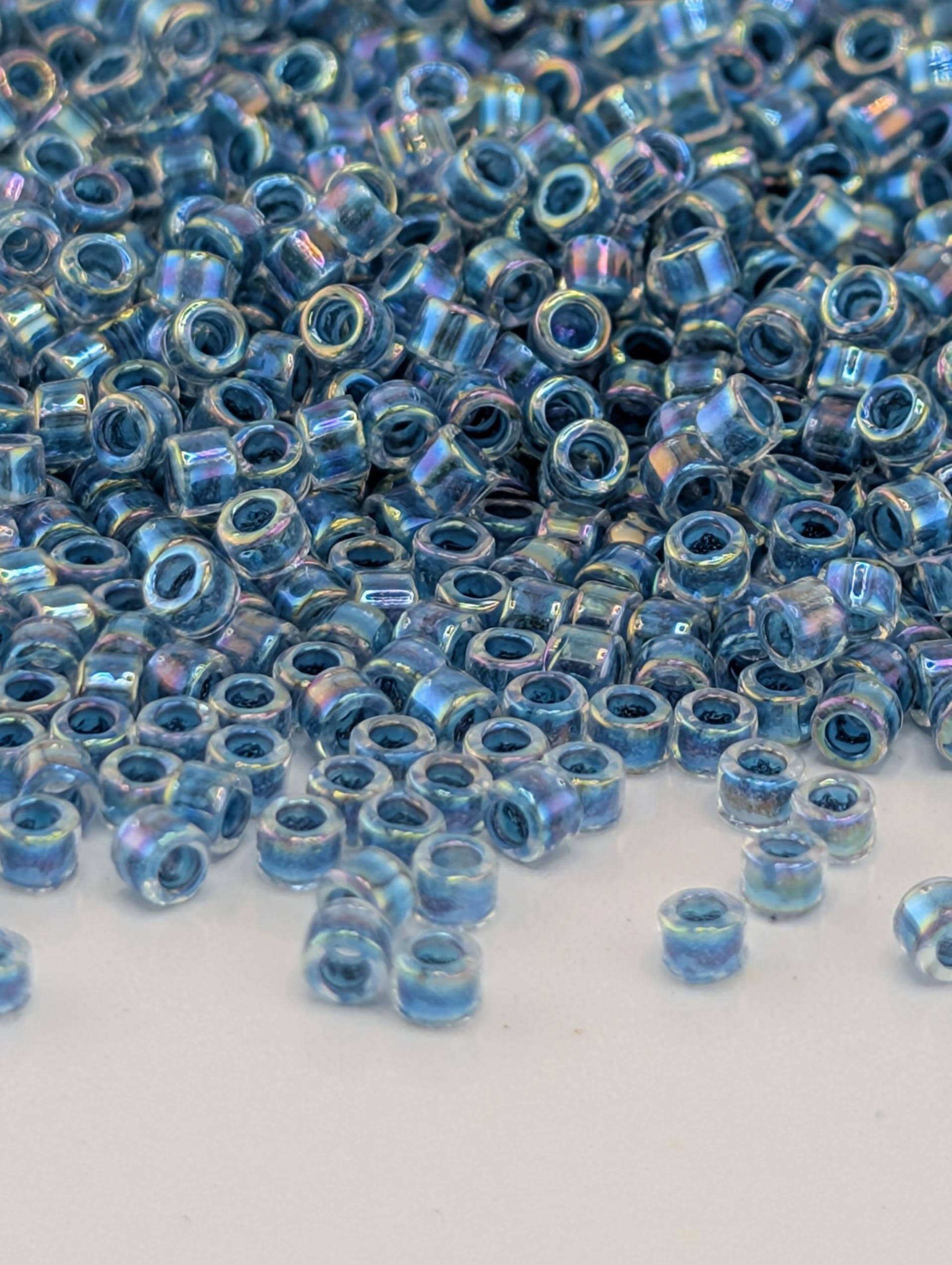 DB0058:Crystal/Slate Blue Inside Color Lined Rainbow | Size 11/0 | 7g