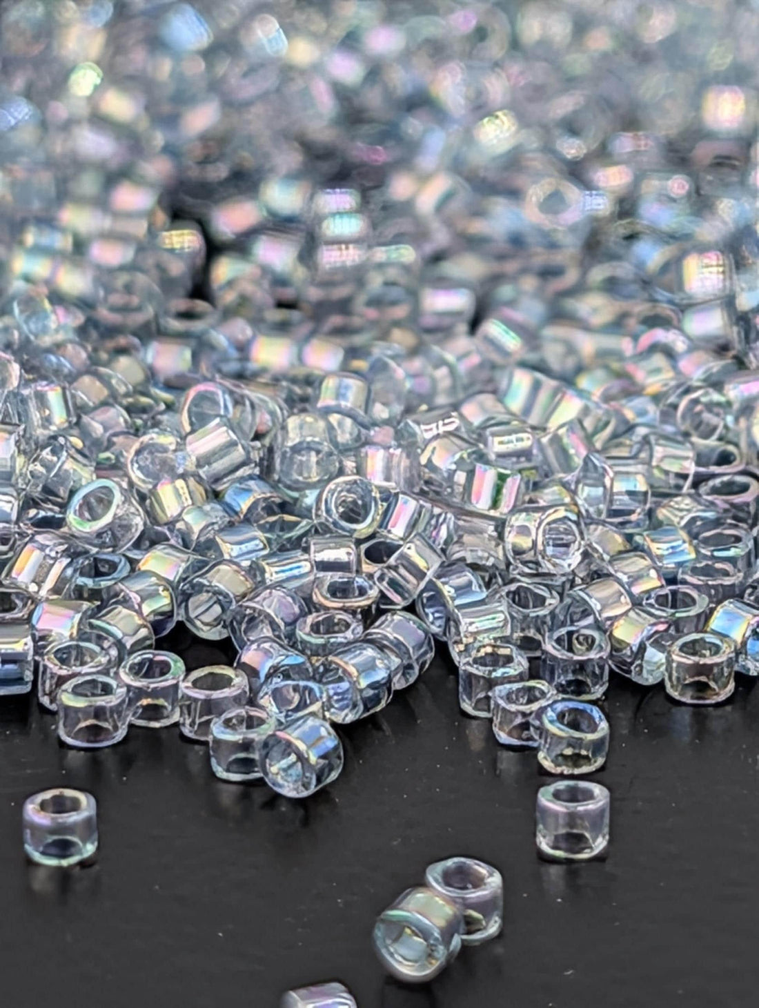 DB0110:Light Grey-Blue Translucent Inside Color Lined Rainbow | Size 11/0 | 7g