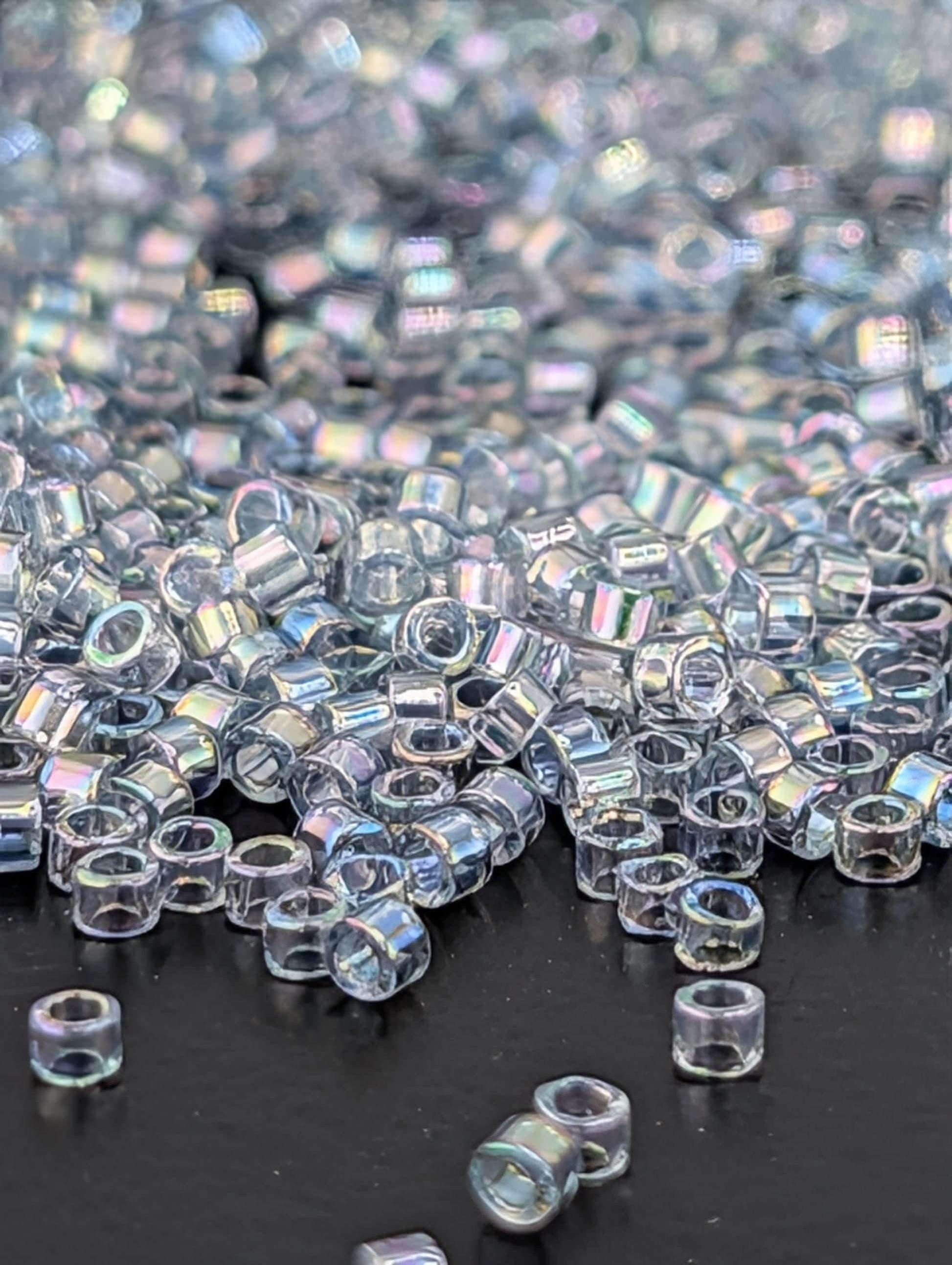 DB0110:Light Grey-Blue Translucent Inside Color Lined Rainbow | Size 11/0 | 7g