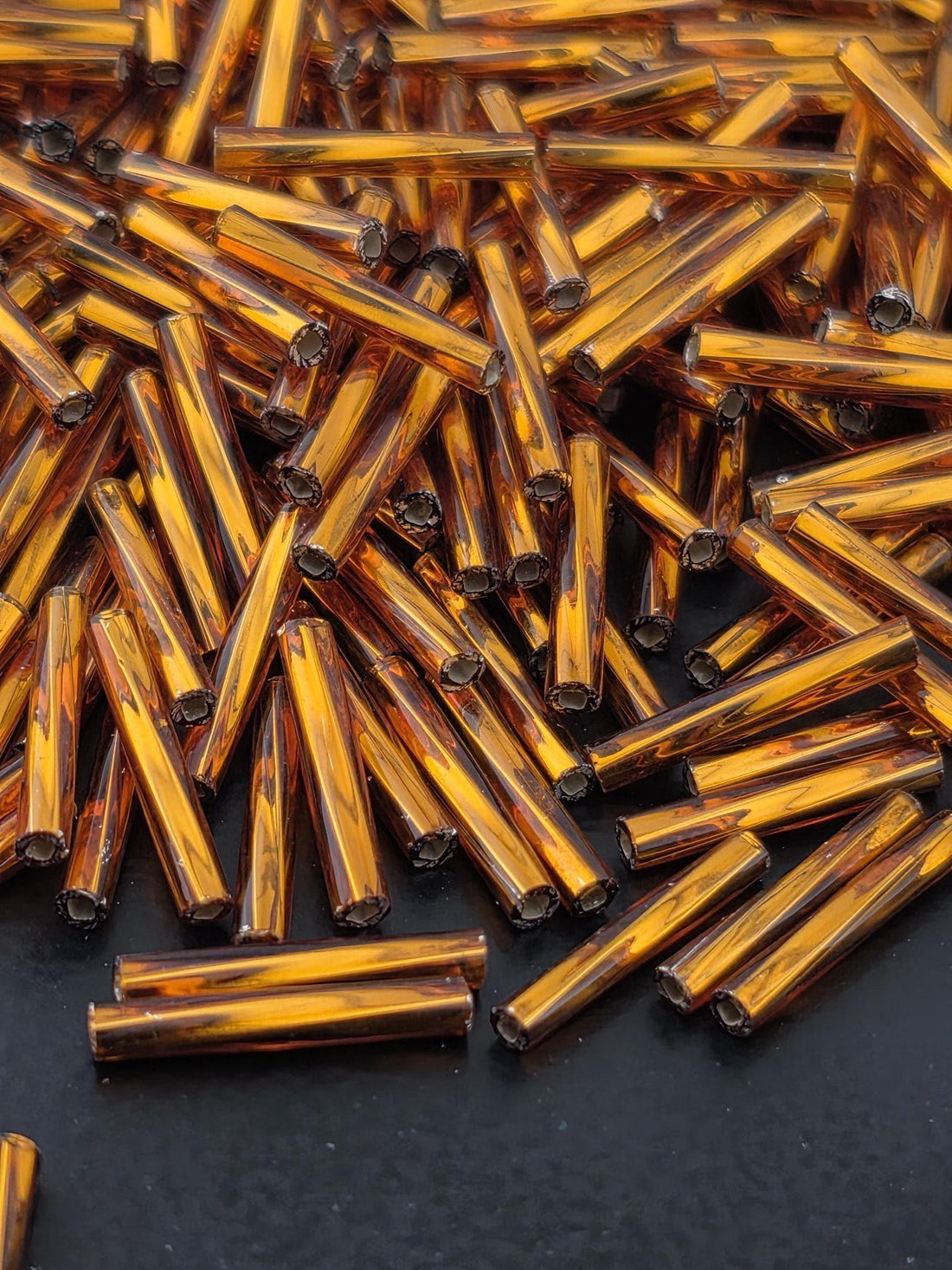 Miyuki Twisted Bugles 2x12 Dark Topaz Translucent Silver-Lined Size 2x12mm