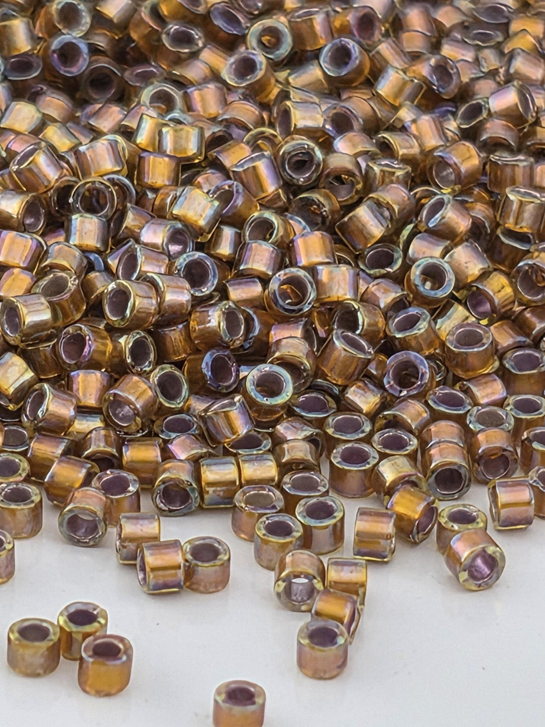 DB1691:Dark Walnut Brown Translucent Silver-Lined Rainbow | Size 11/0 | 7g