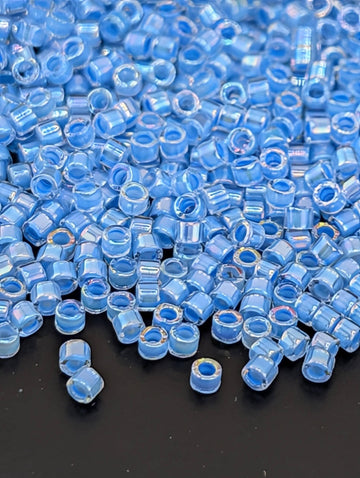DB0076:Crystal/Medium Blue Inside Color Lined Rainbow | Size 11/0 | 7g