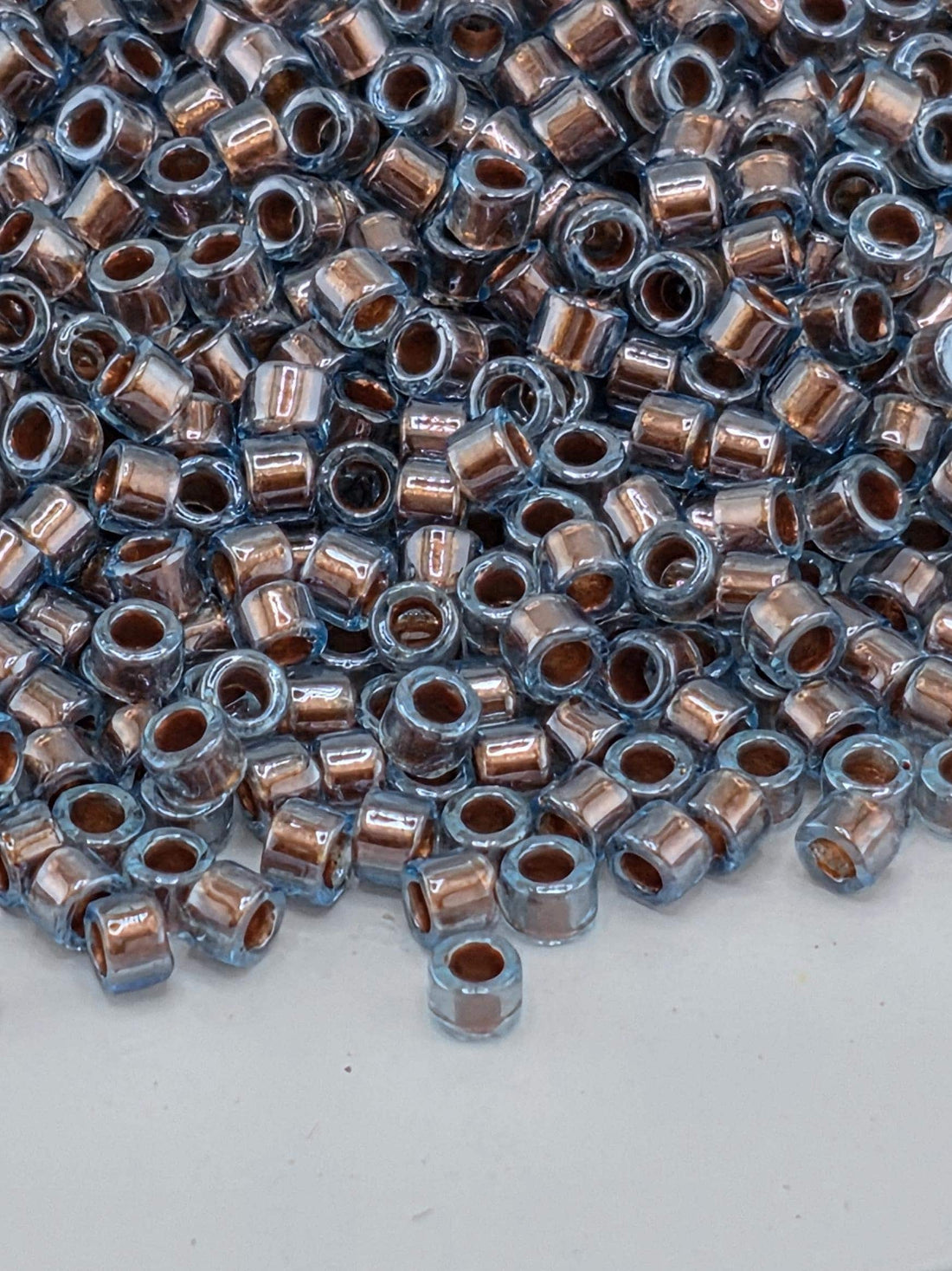 DB1706:Blue/Dark Copper Translucent Inside Color Lined Pearl | Size 11/0 | 7g