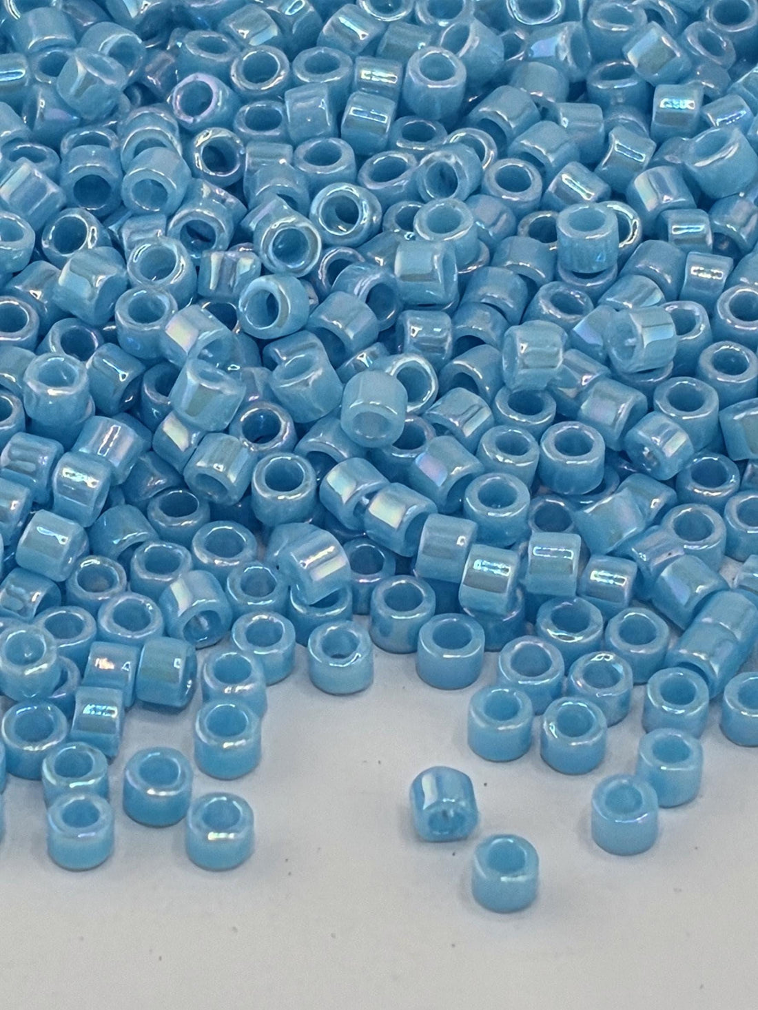 DB0164:Sky Blue Opaque Rainbow | Size 11/0 | 7g