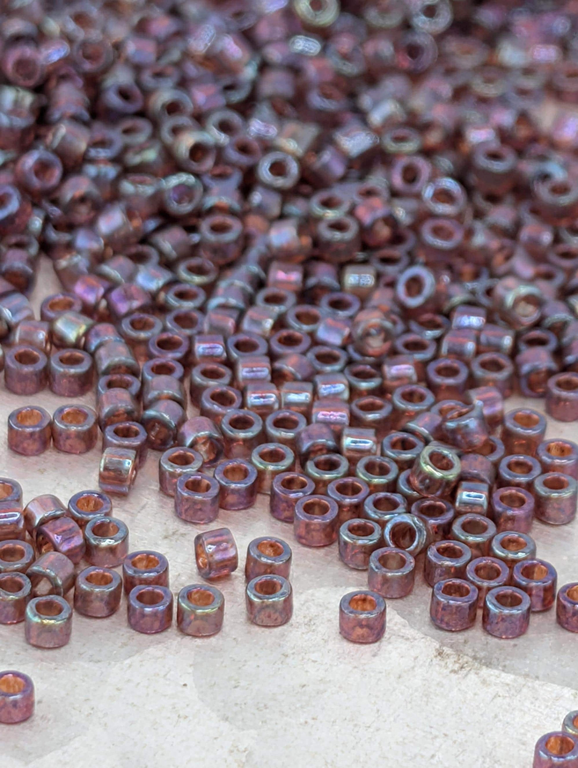 DB0104:Raspberry Translucent Inside Color Lined Rainbow | Size 11/0 | 7g