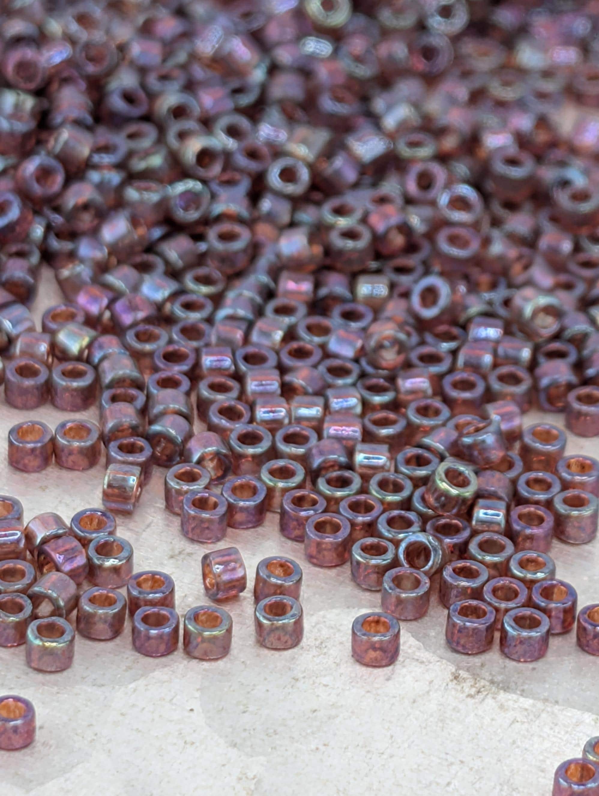 DB0104:Raspberry Translucent Inside Color Lined Rainbow | Size 11/0 | 7g