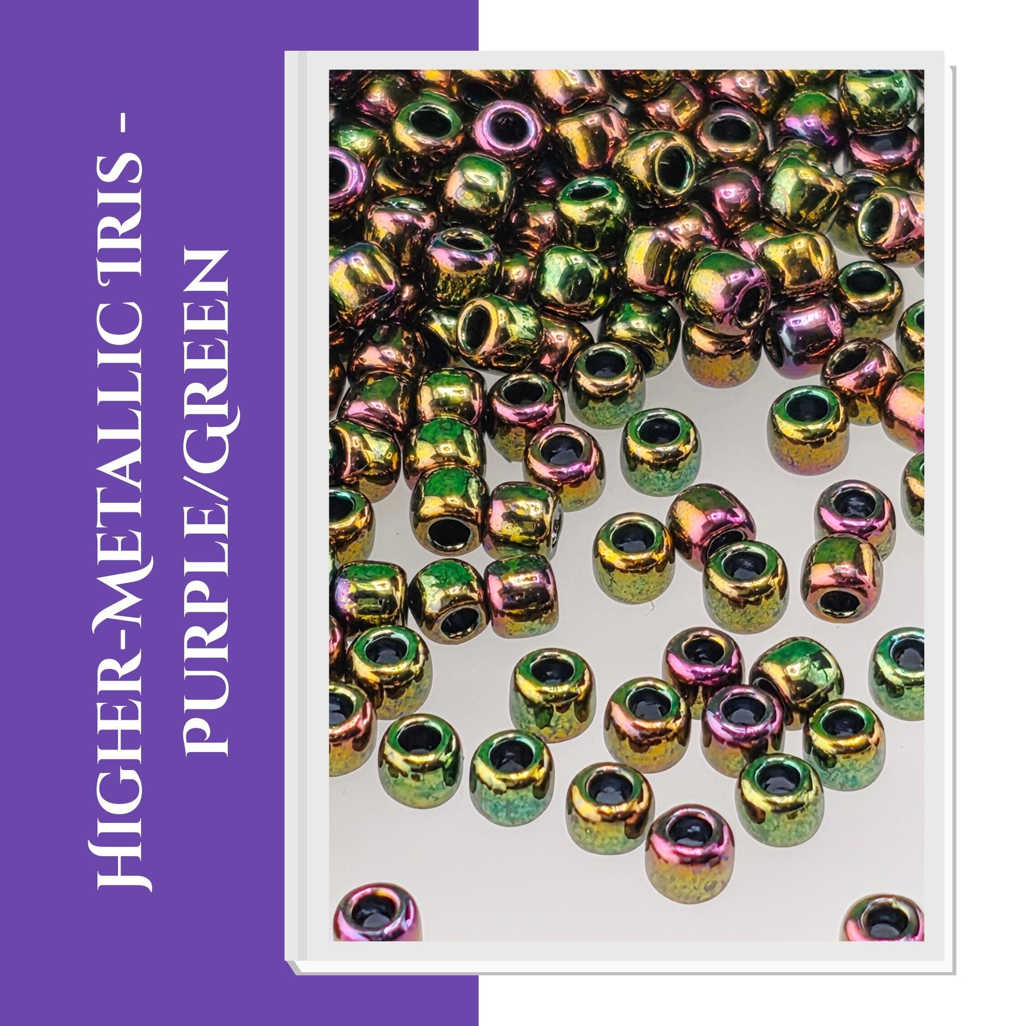 a collection of multicolored beads, including purple, green, and yellow, scattered across a surface.