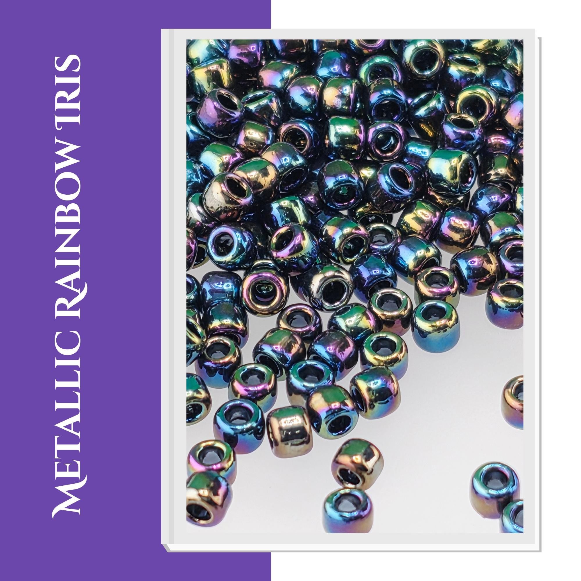 The image is a close-up of a pile of multicolored, iridescent beads, with the text "METALIC RICH" visible.