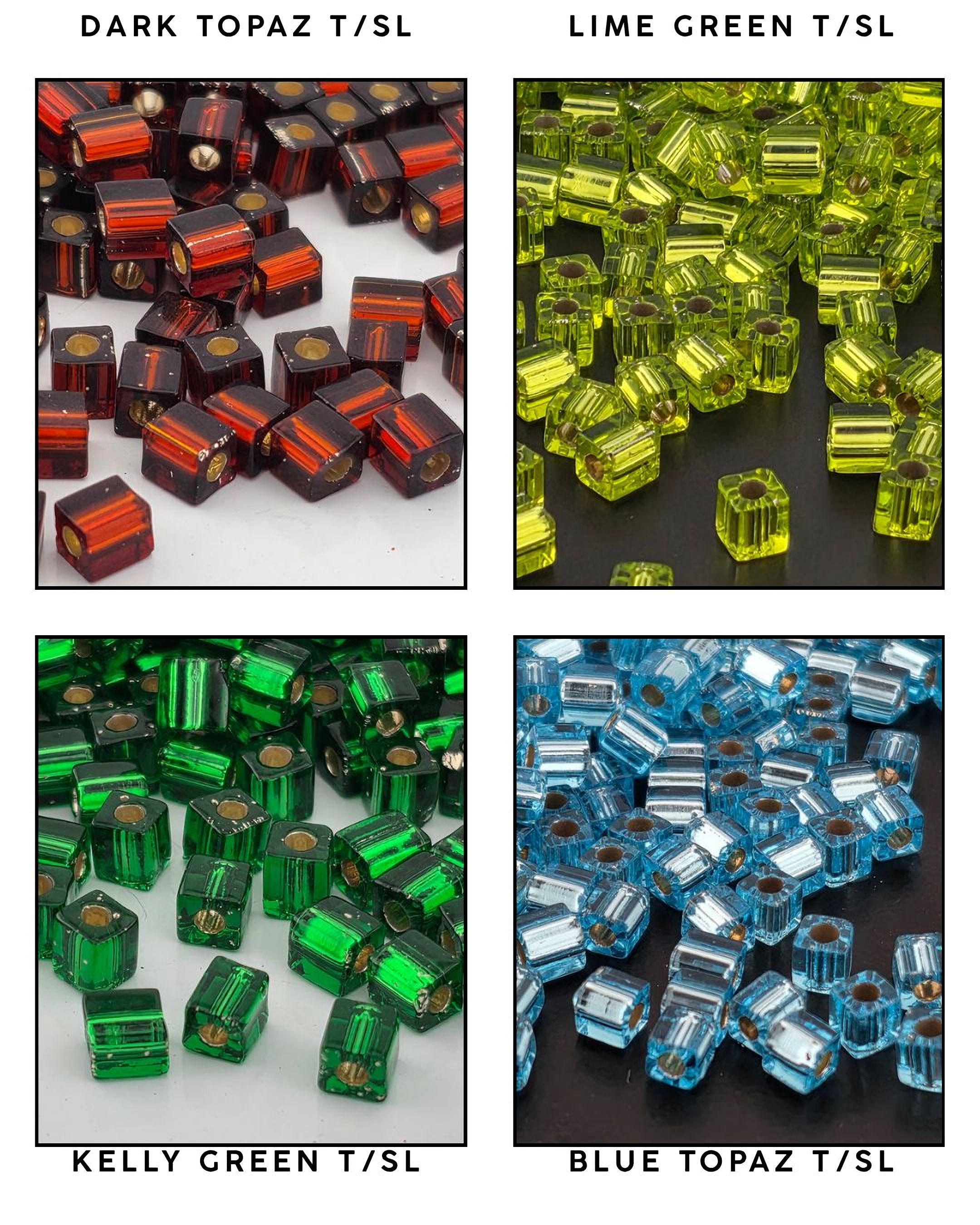four different color-coded glass beads, each with a unique color and pattern. The beads are arranged in a grid format, with each row representing a different color and each column representing a different type of bead. The colors and patterns of the beads vary, creating a visually appealing and diverse display.