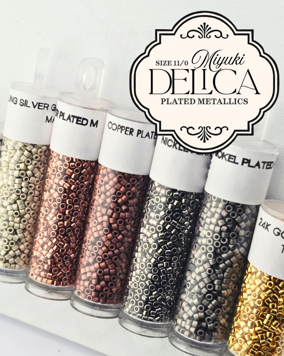A collection of metal beads in various sizes and colors, including copper, silver, and gold, arranged in rows.