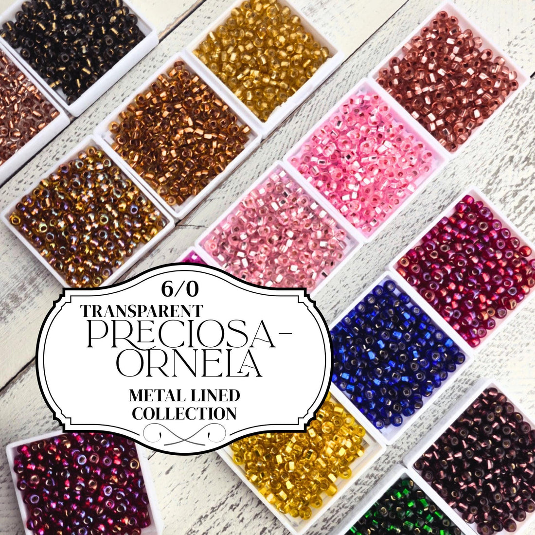 a collection of metal-lined containers filled with various colored beads, including clear beads and colored beads, arranged on a wooden surface.