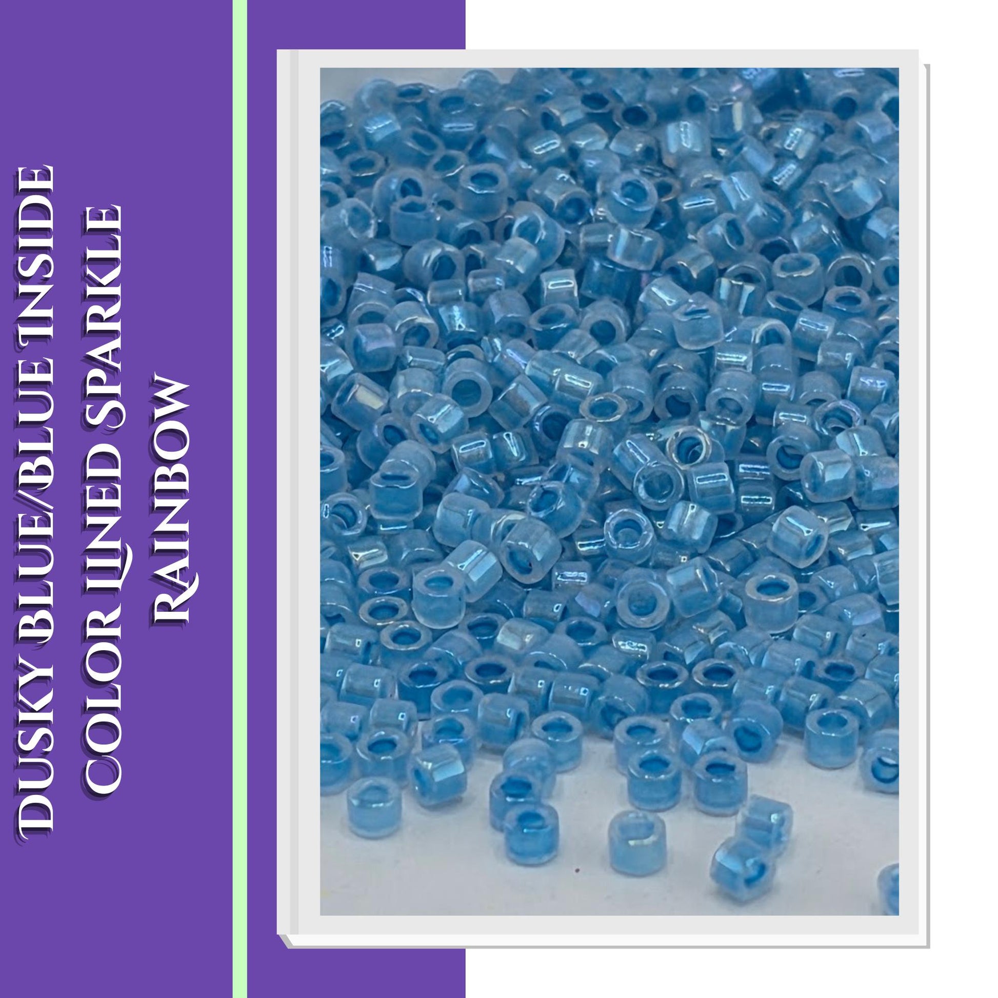 The image is a close-up of numerous small blue beads or beads, possibly made of glass or plastic, scattered on a surface.