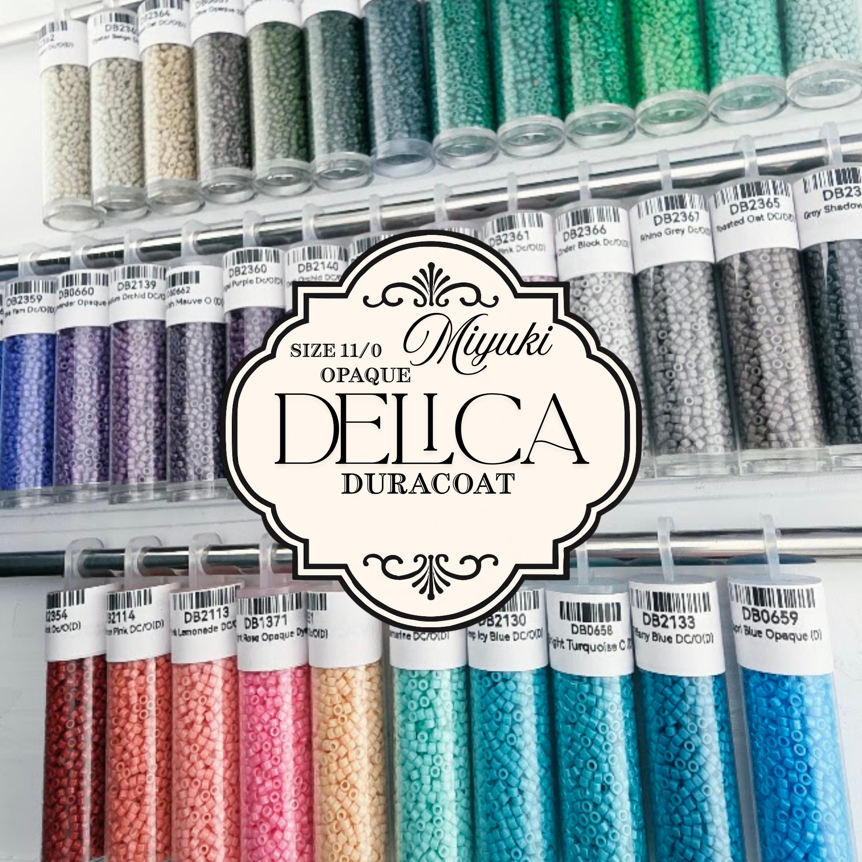 a collection of colorful glass beads in various sizes and colors, arranged in rows and columns. The beads are labeled with numbers and text, indicating their sizes and possibly their names or types. The image does not contain any text that can be described in fewer than 500 characters, and it does not include any phrases like 'The image depicts', 'The image displays', 'The image shows', 'In the image', 'The image captures', 'The image features', or