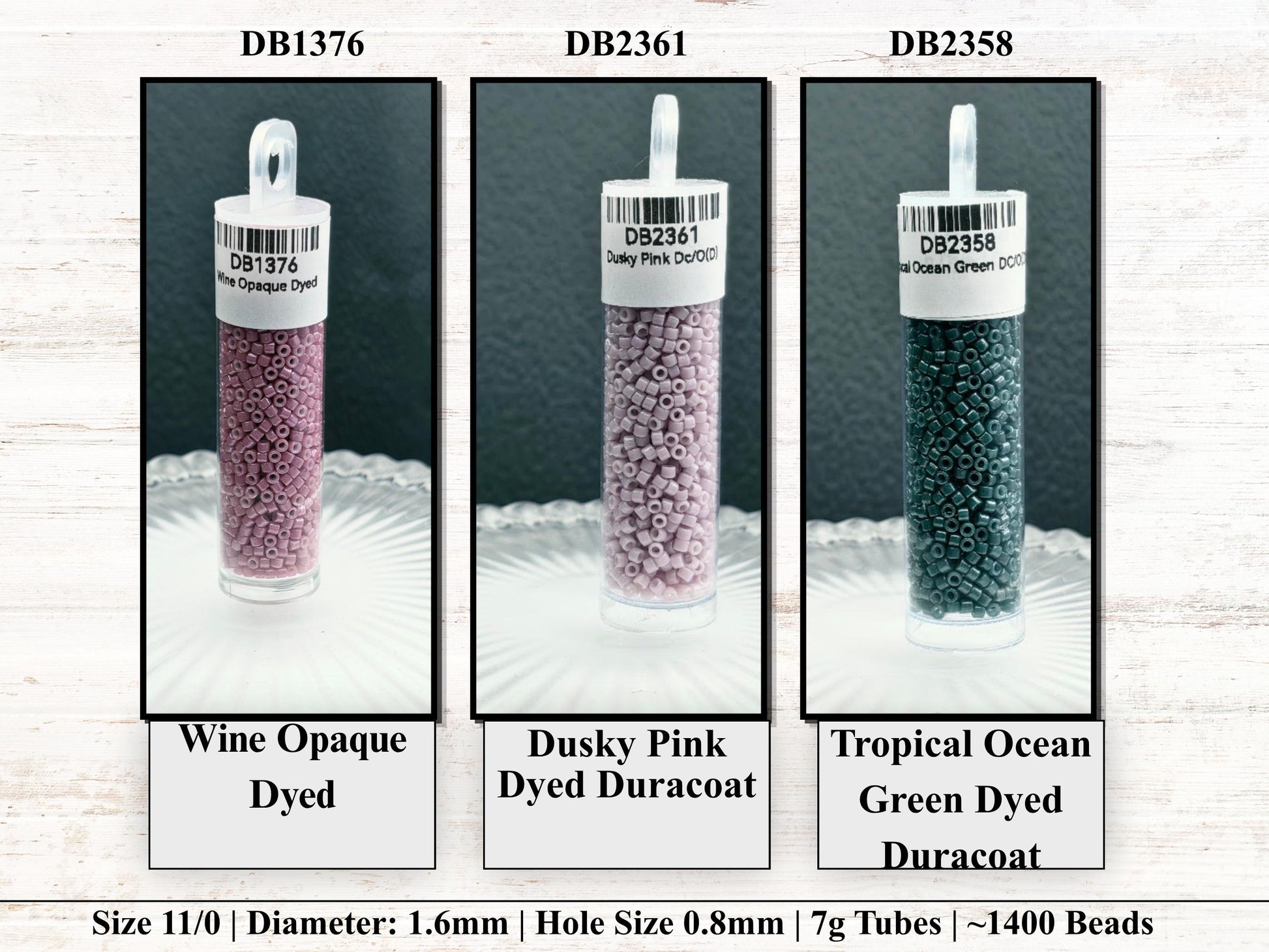 three different types of beads, each with a label indicating the color and size. The beads are arranged in a row, with the first one being a wine-colored opaque dyed bead, the second one being a dusky pink dyed opaque, and the third one being a tropical ocean green dyed Duracoat.