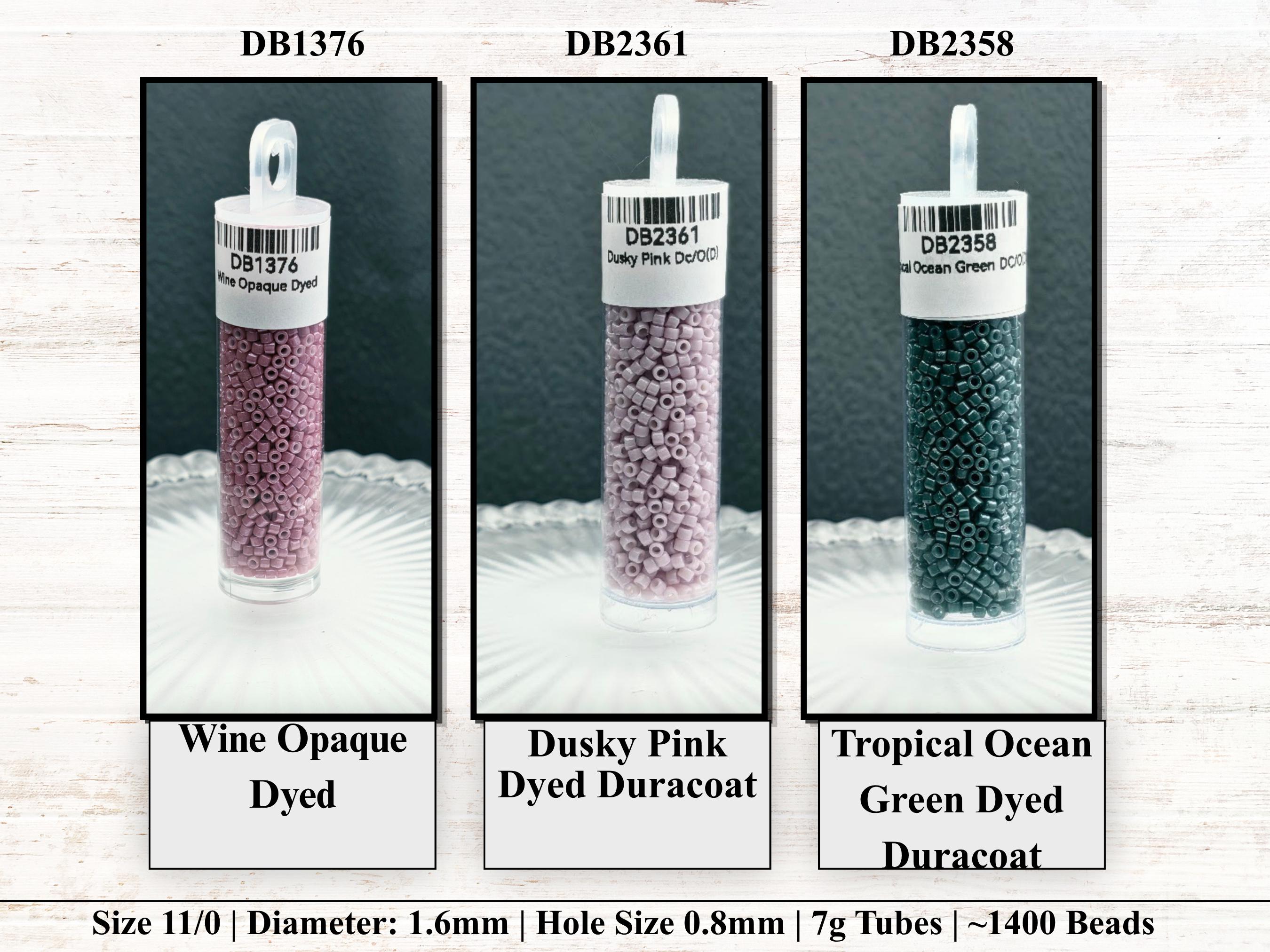three different types of beads, each with a label indicating the color and size. The beads are arranged in a row, with the first one being a wine-colored opaque dyed bead, the second one being a dusky pink dyed opaque, and the third one being a tropical ocean green dyed Duracoat.