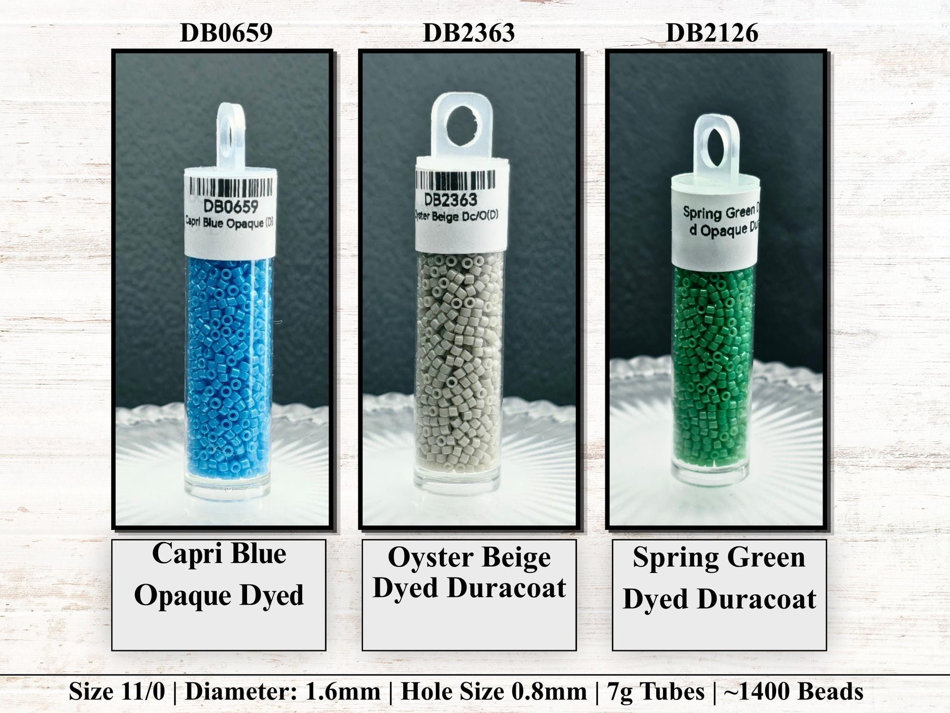 three different types of dyed beads in glass containers, each with a different color and size.