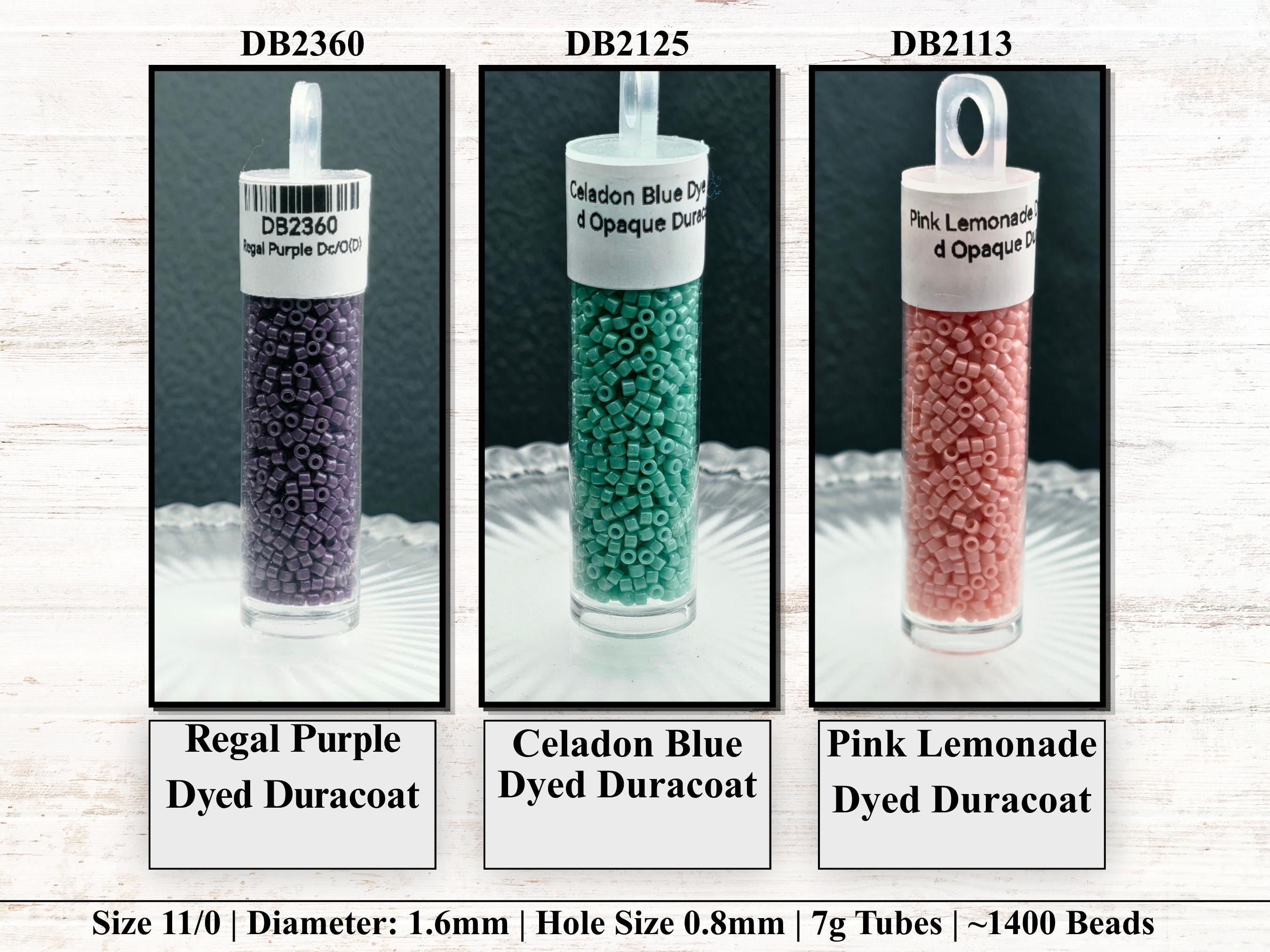 three different colored beads in glass containers, each labeled with its name and size.
