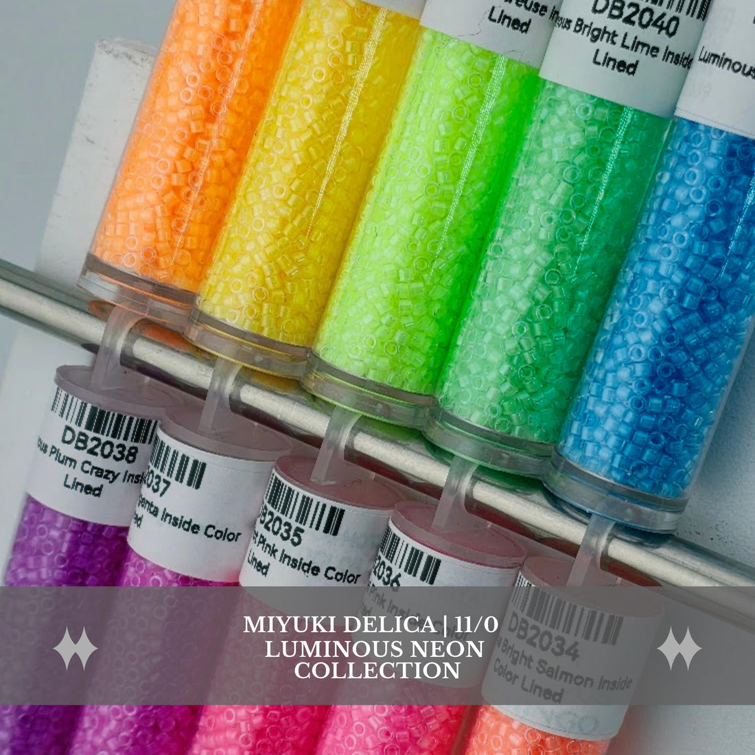 A collection of colorful cylindrical containers filled with neon-colored beads or grains, arranged in a row on a shelf.